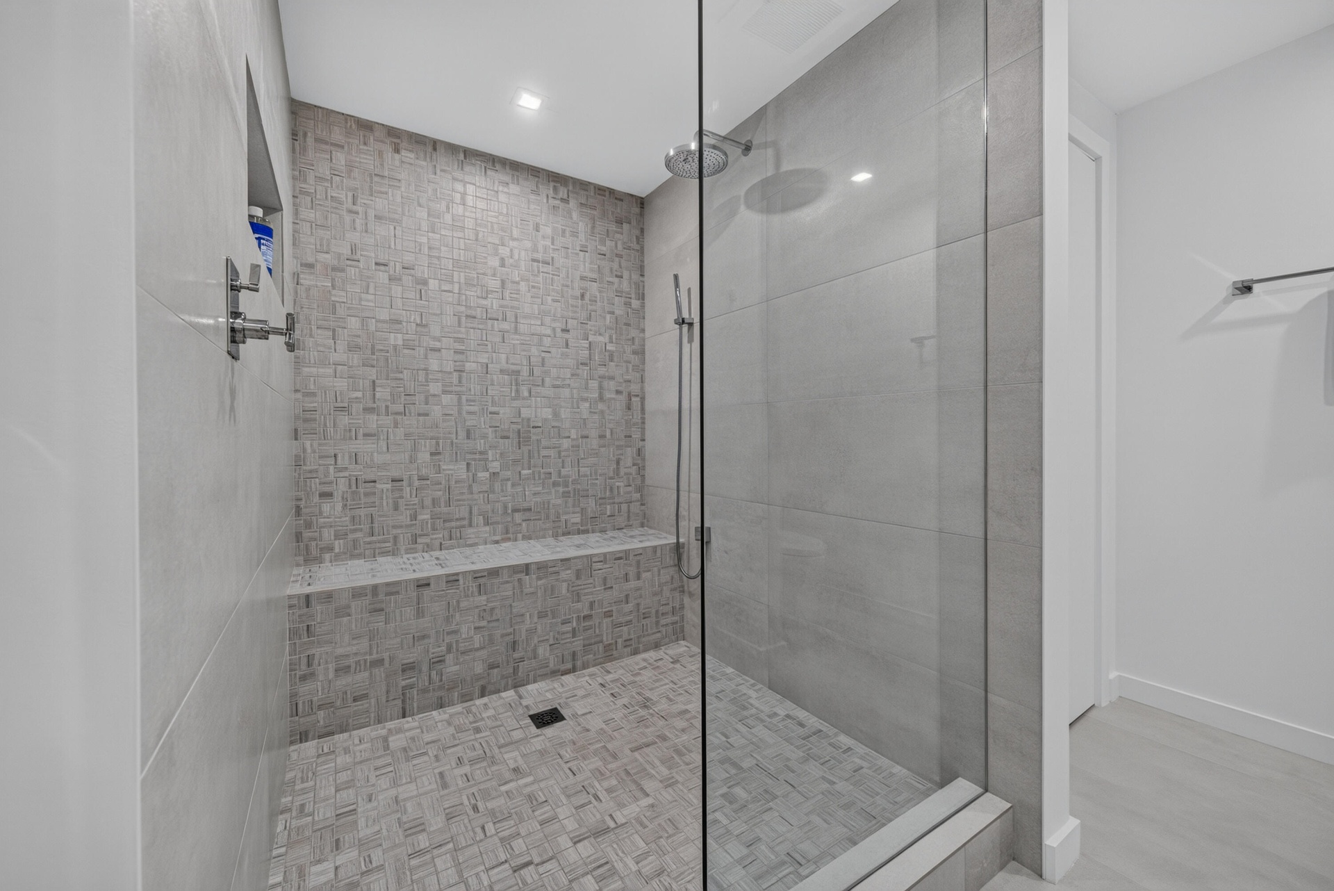 Large luxurious shower with seating