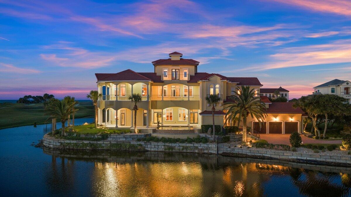 Located behind the exclusive North Gate of Hammock Dunes, this extraordinary Mediterranean estate occupies one of the community’s most iconic peninsul