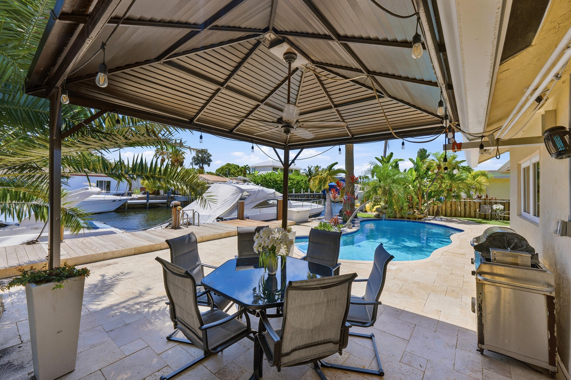 40' Dock, 70' Seawall (2026), 15' x 3' Freeform Pool with Rock Waterfall, Covered Patio, Aluminum Roof & Travertine Patio Pavers 2024