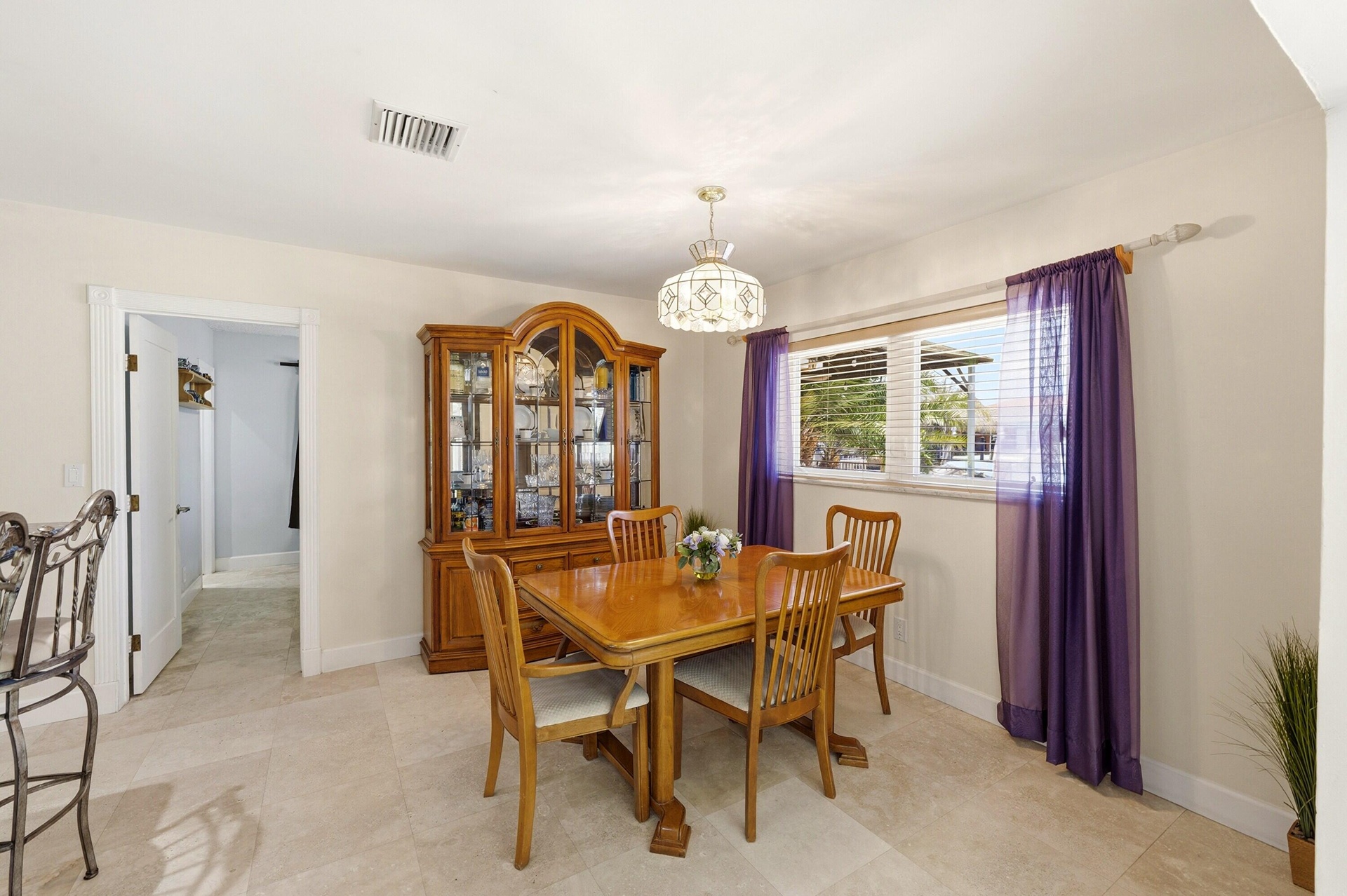 Dining Room is Large Enough for Entertaining & Includes 2 Snack Bars & Pass-Thru. Guest Bedroom is next to Dining Room. Dining Room Chandelier doesn't