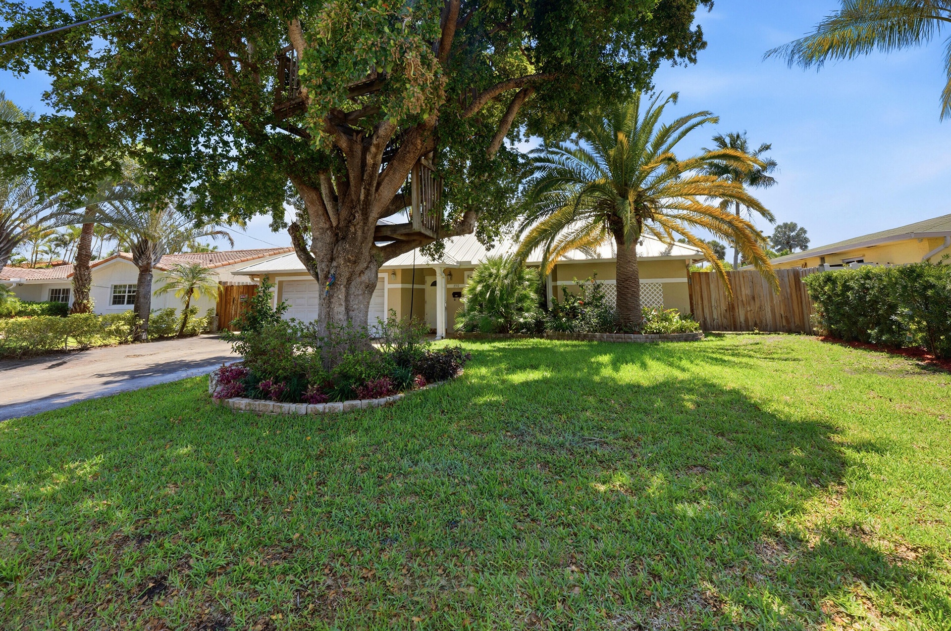 Beautiful, Mature, Lush Landscape surrounds the property. Lots of Parking with a Wide Gate on the South Side of the Home.