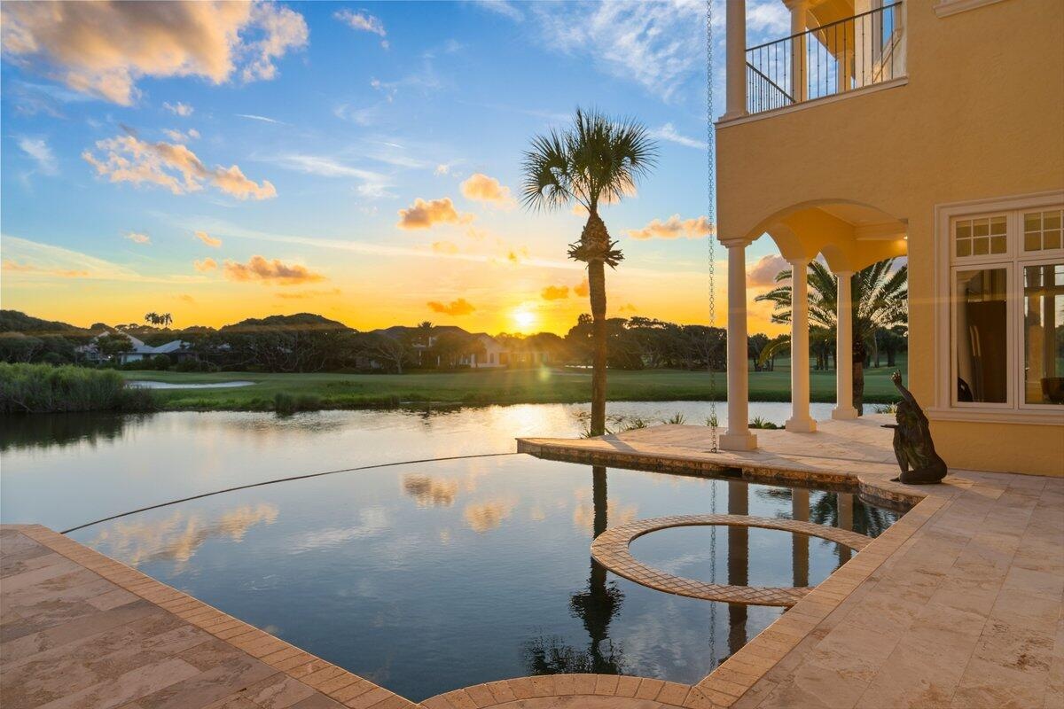 Located behind the exclusive North Gate of Hammock Dunes, this extraordinary Mediterranean estate occupies one of the community’s most iconic peninsul