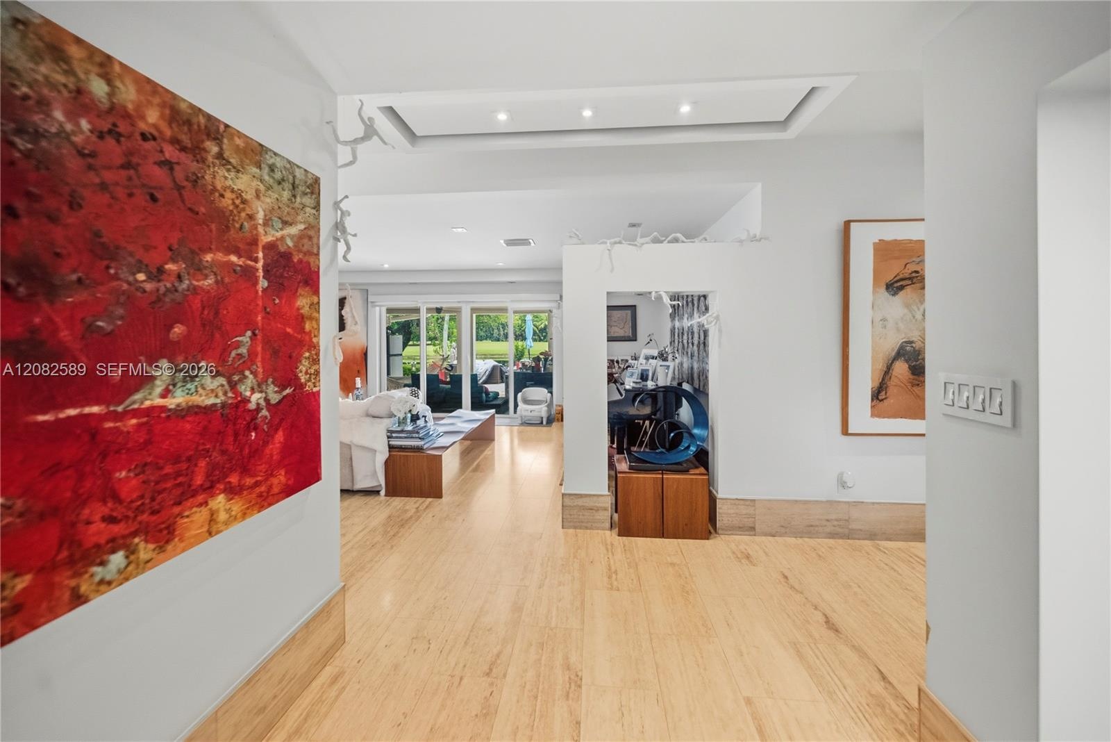 Refined interior hallway with modern lighting and seamless flow into the main living area.