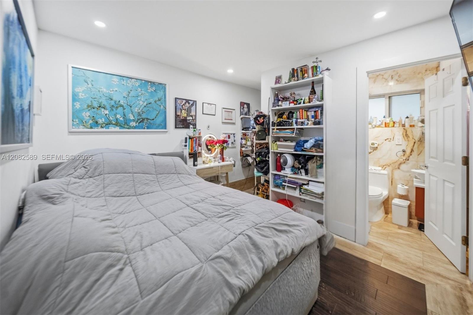 Cozy Secondary Bedroom 1 featuring a private en-suite bathroom and a bright, comfortable layout.