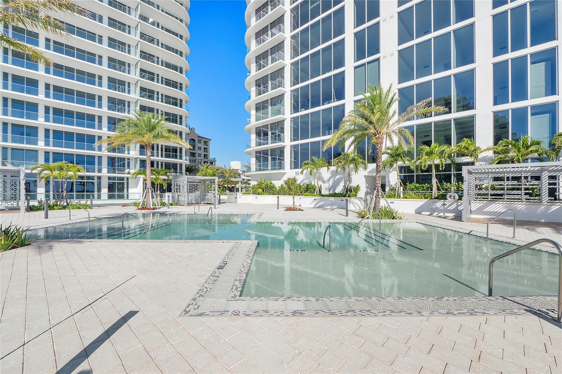 The "sunrise" pool area with beach shelfs & cabanas for tanning & relaxation.