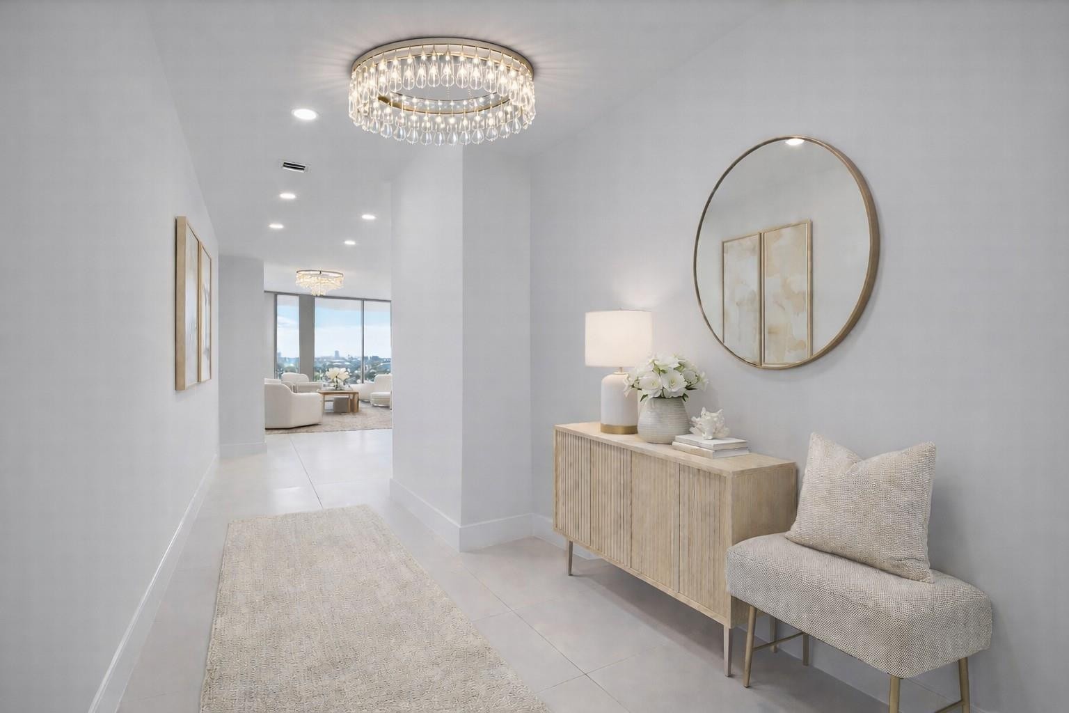 The entryway of the condo, chandelier not included. Virtually staged.