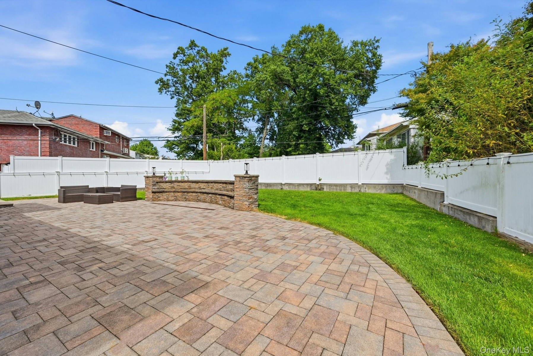 Paver patio with custom stone seating area