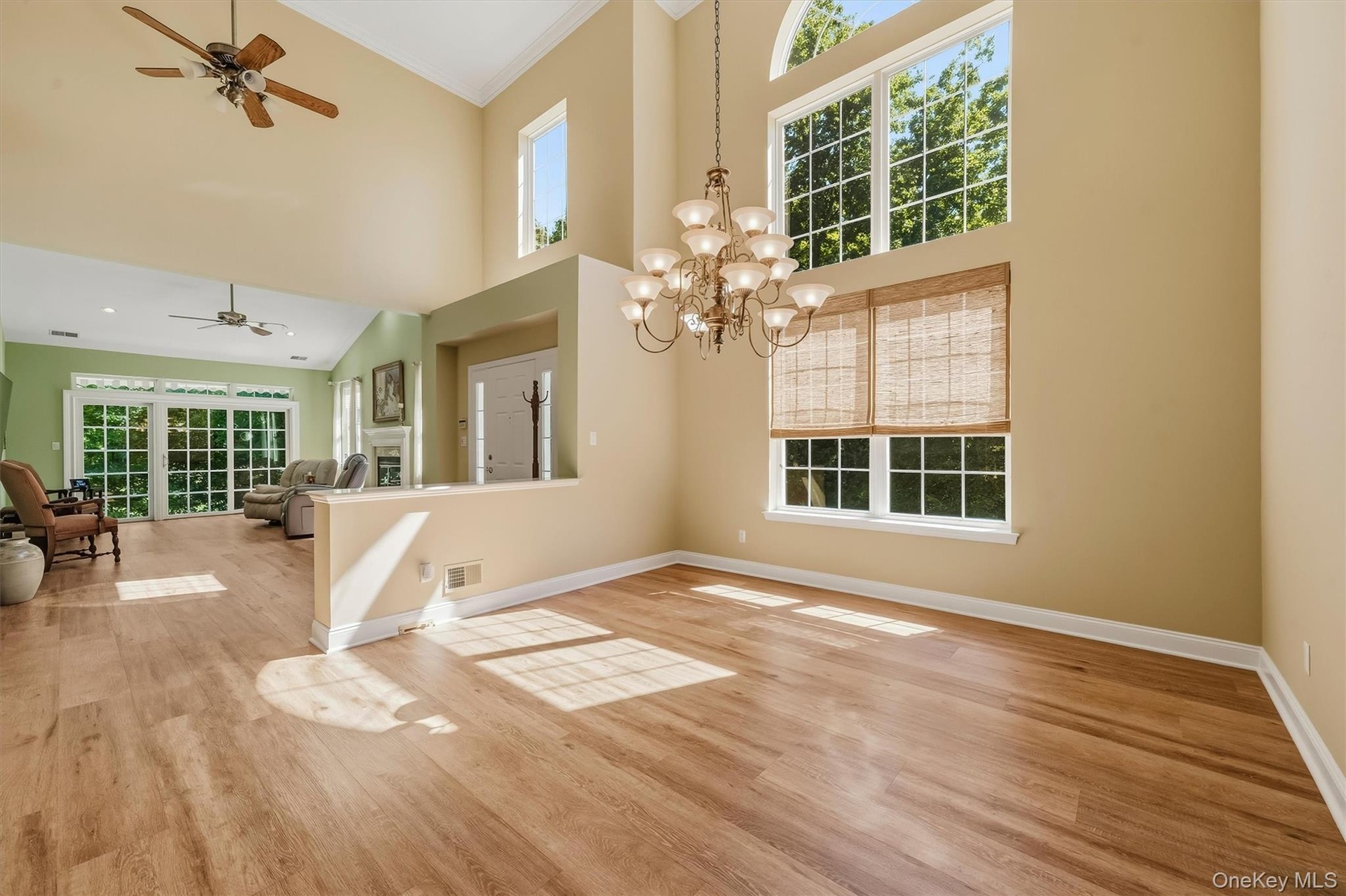 Soaring vaulted ceilings with wood-finish flooring