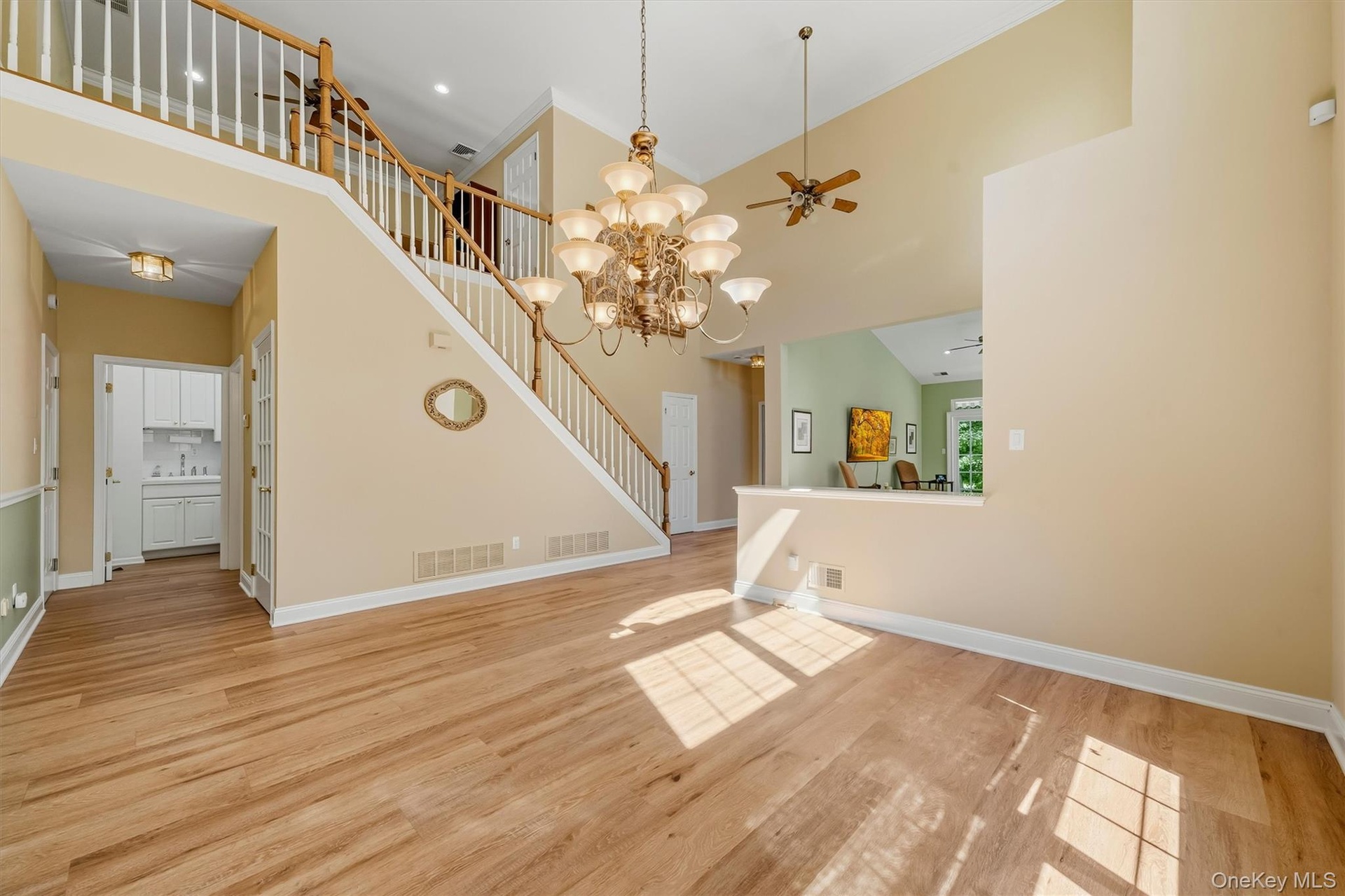 Open area living room with access to stairs