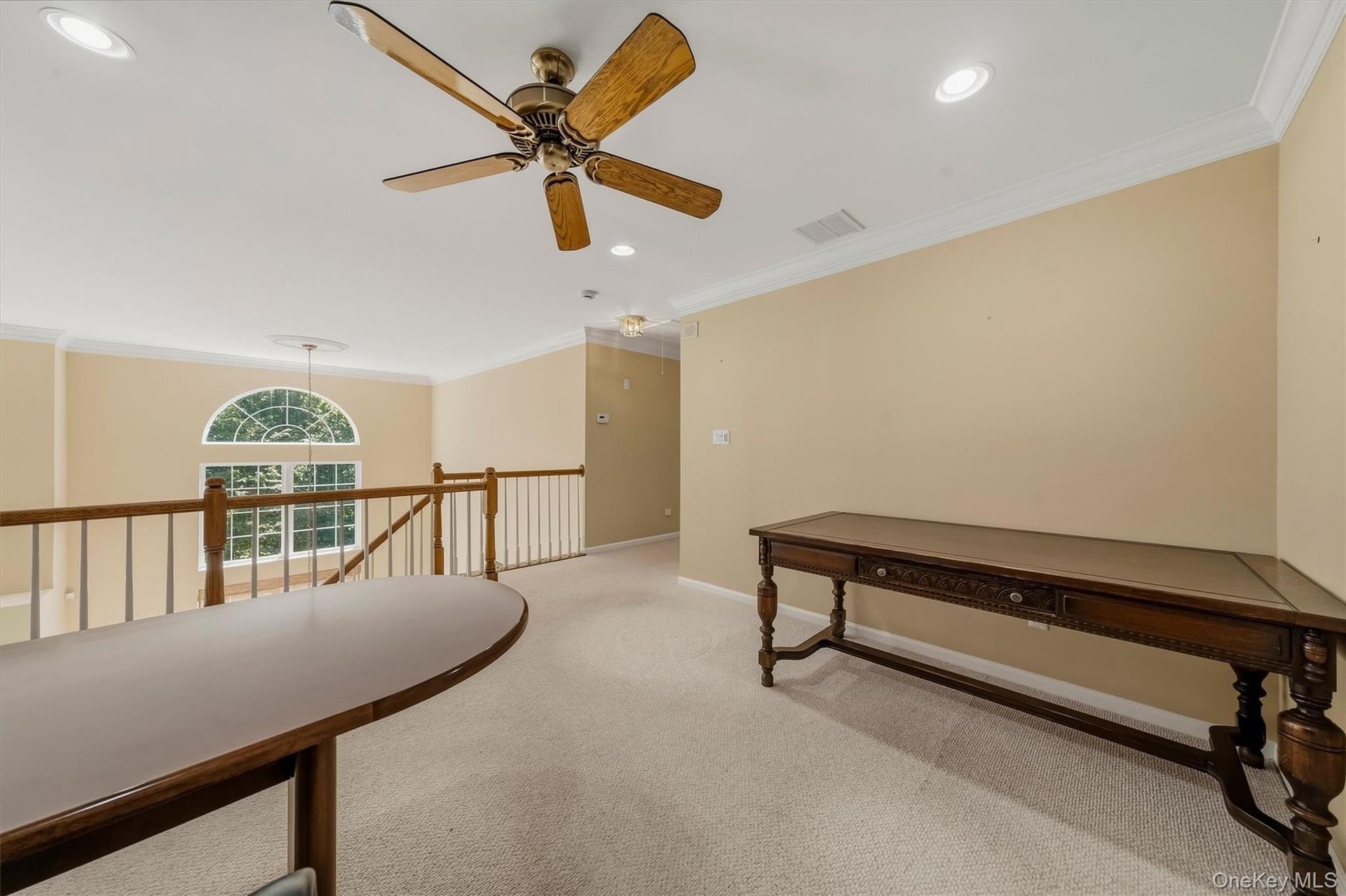 Carpeted loft area with recessed lighting, a ceiling fan, and crown molding