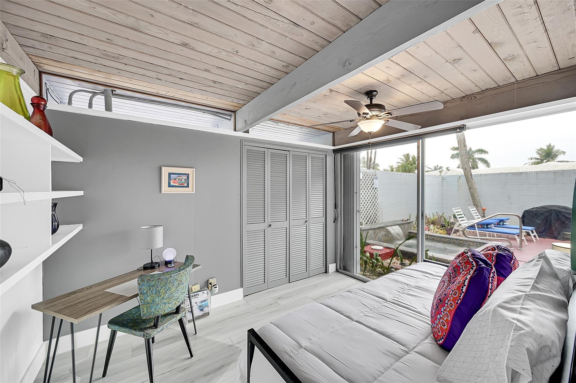 third bedroom with sliders to plunge pool and patio
