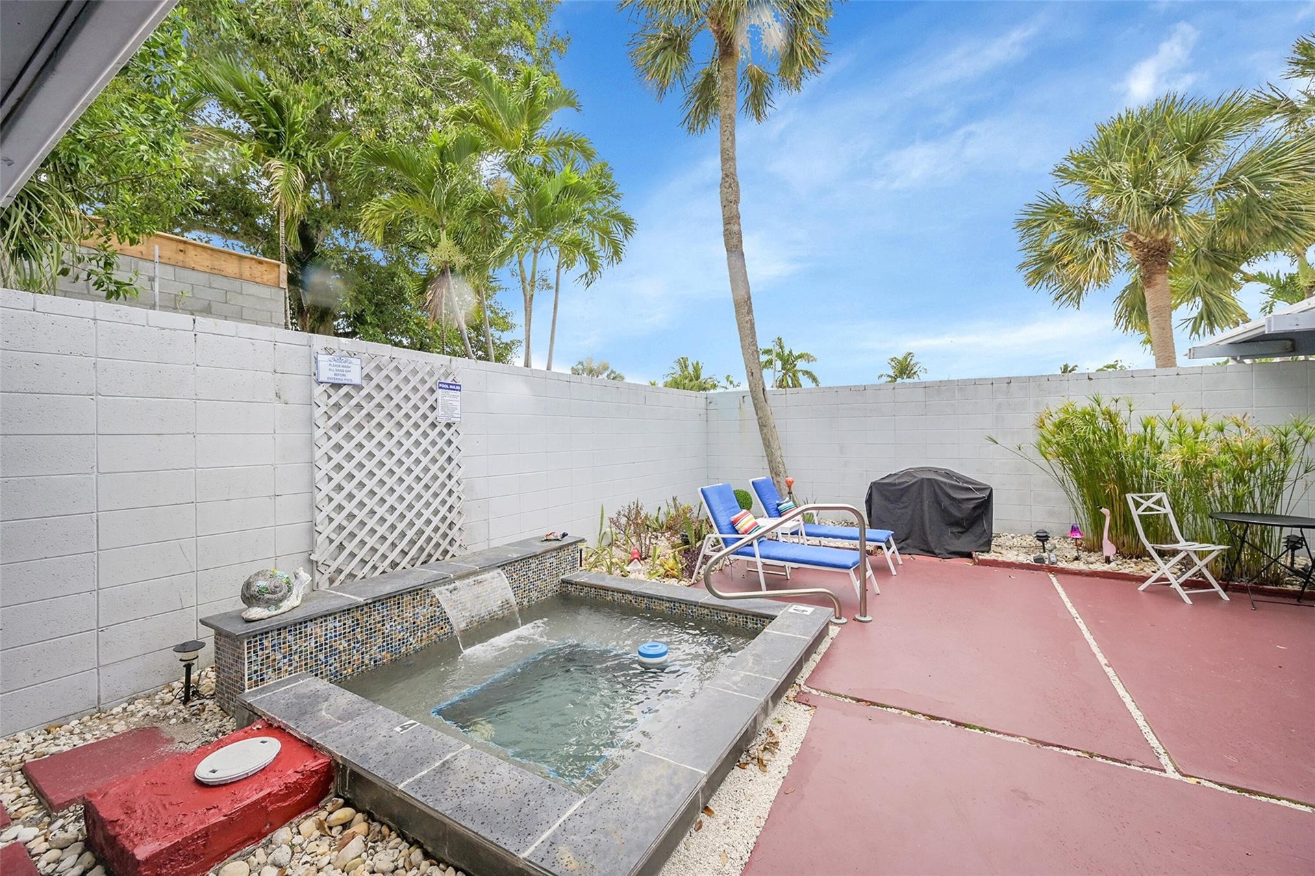 BBQ grill and table and chairs for outdoor dining!