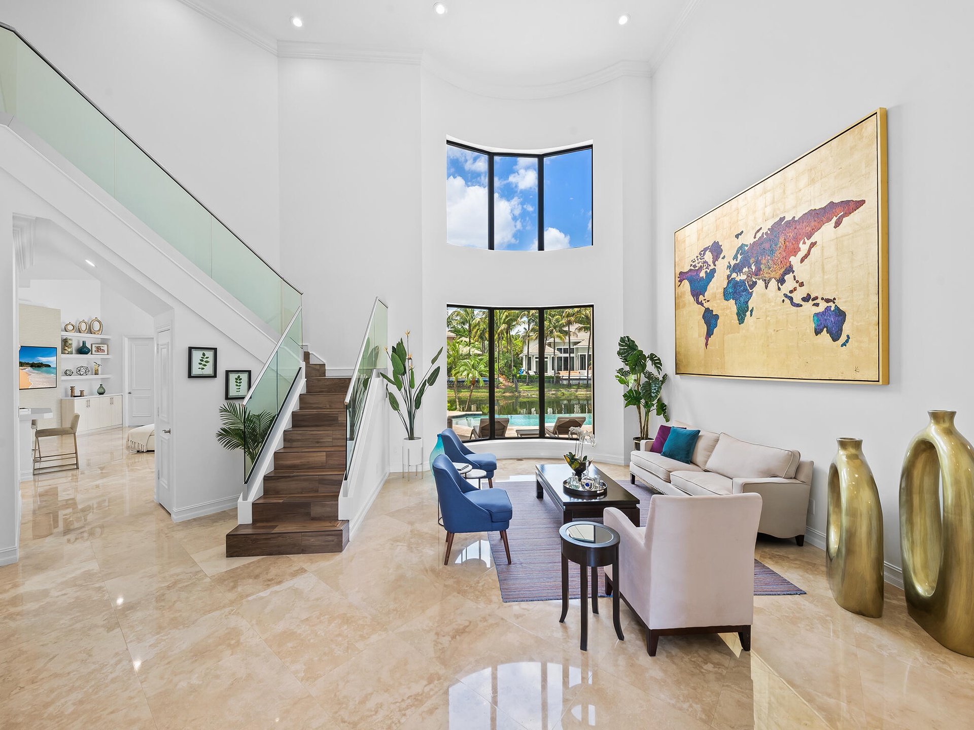 Living Room with Glass Stair Railings