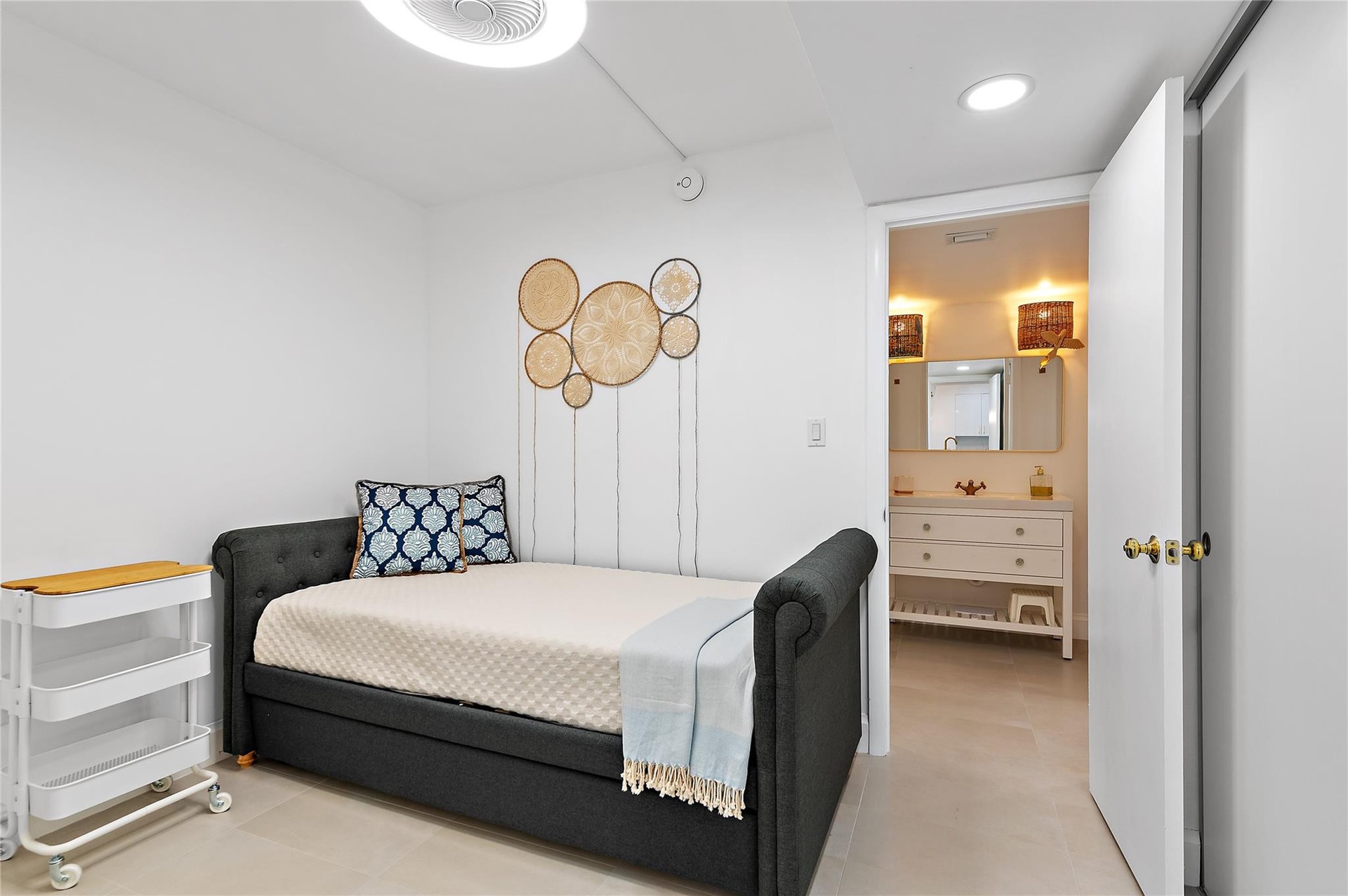 Second room with closet and passway to full bathroom.