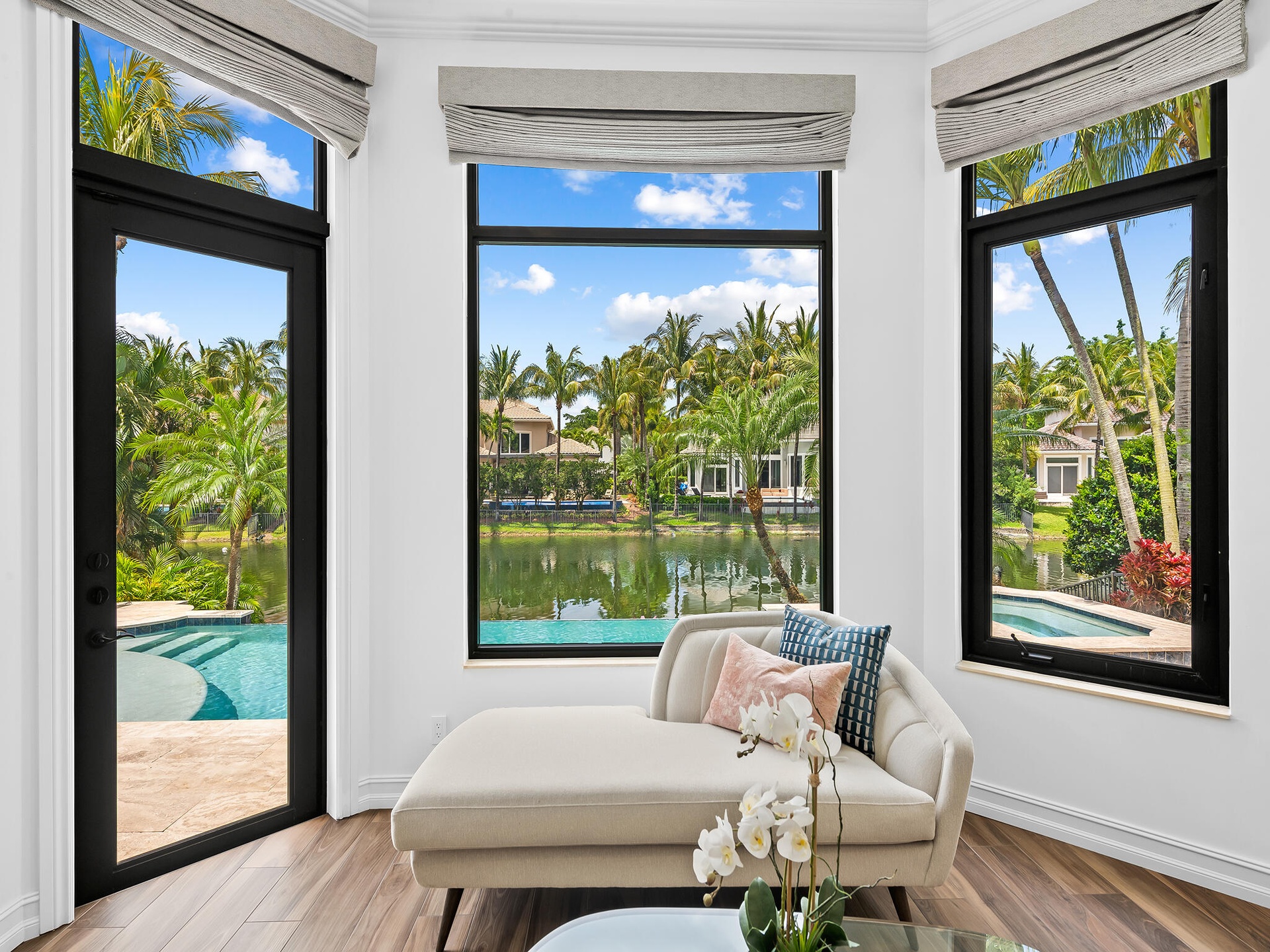 Primary Suite Sitting Area Overlooking Pool and Water View