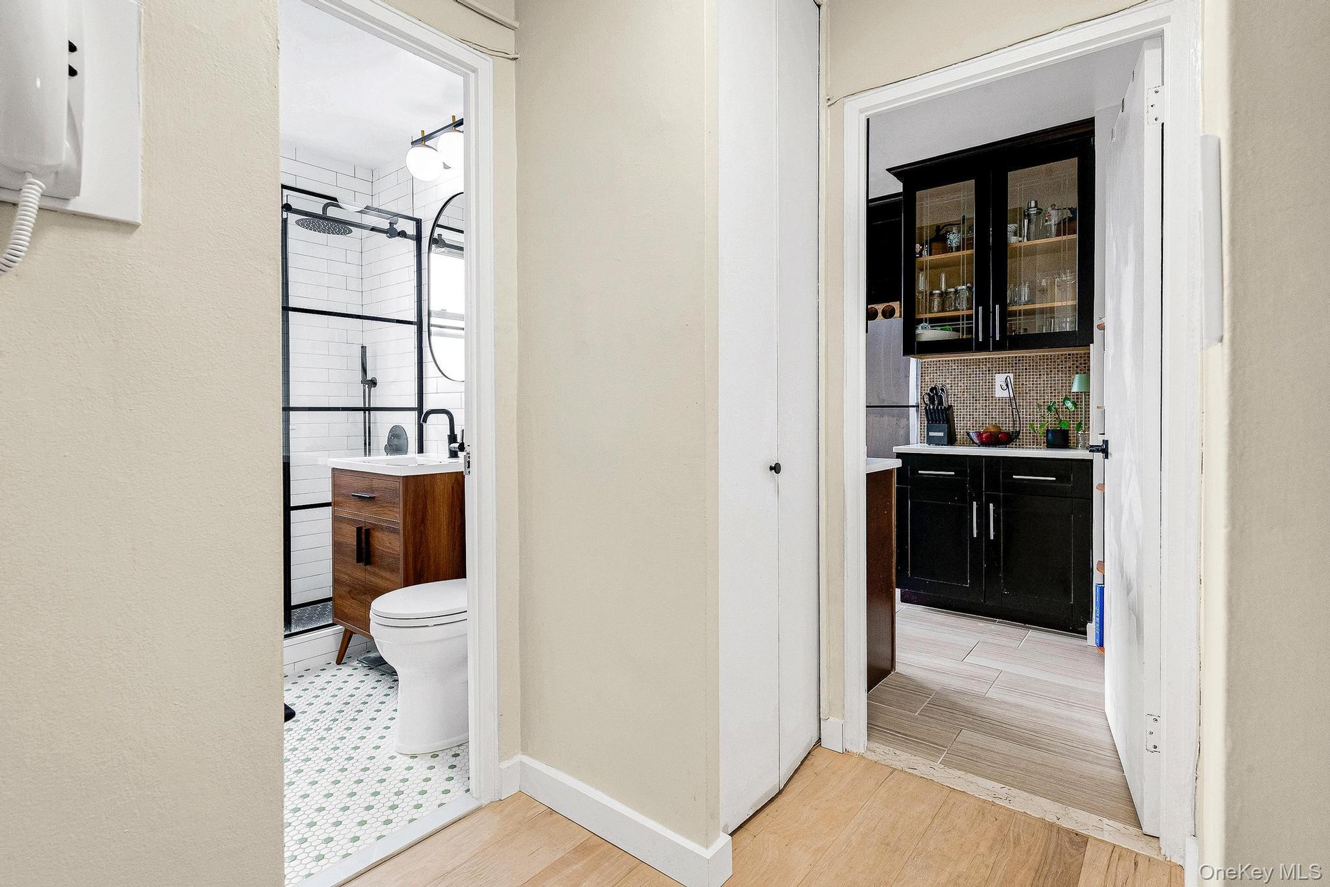 Hall with light wood-style flooring