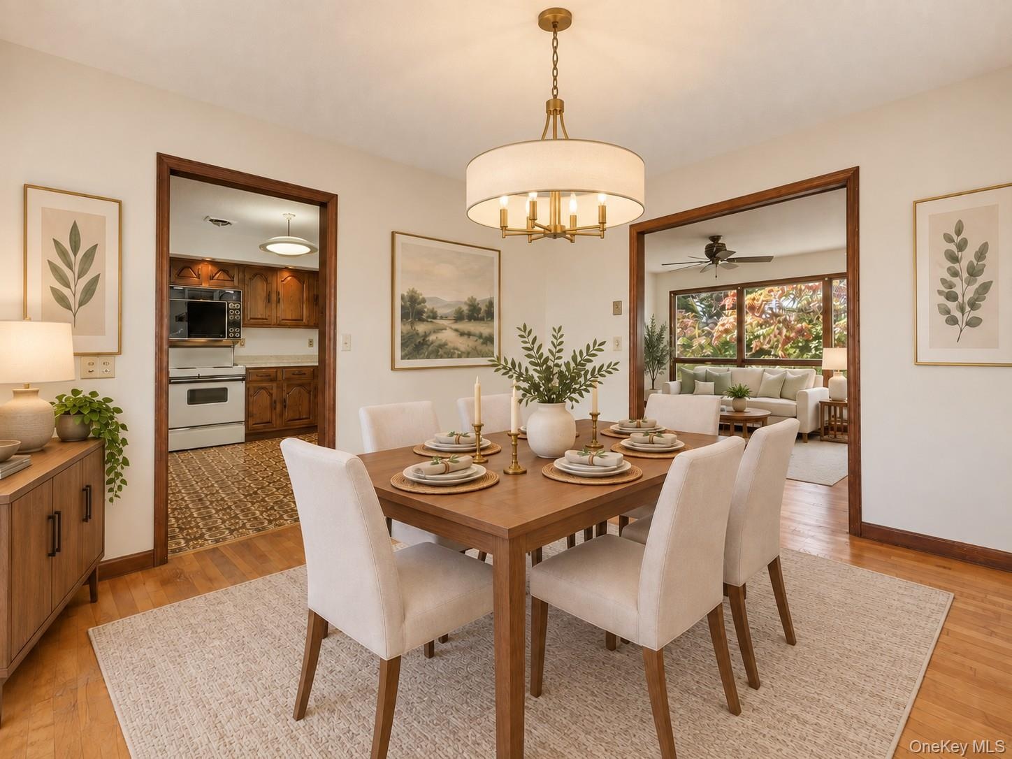 Dining room featuring sliders to deck and hard wood floors / Virtually Staged