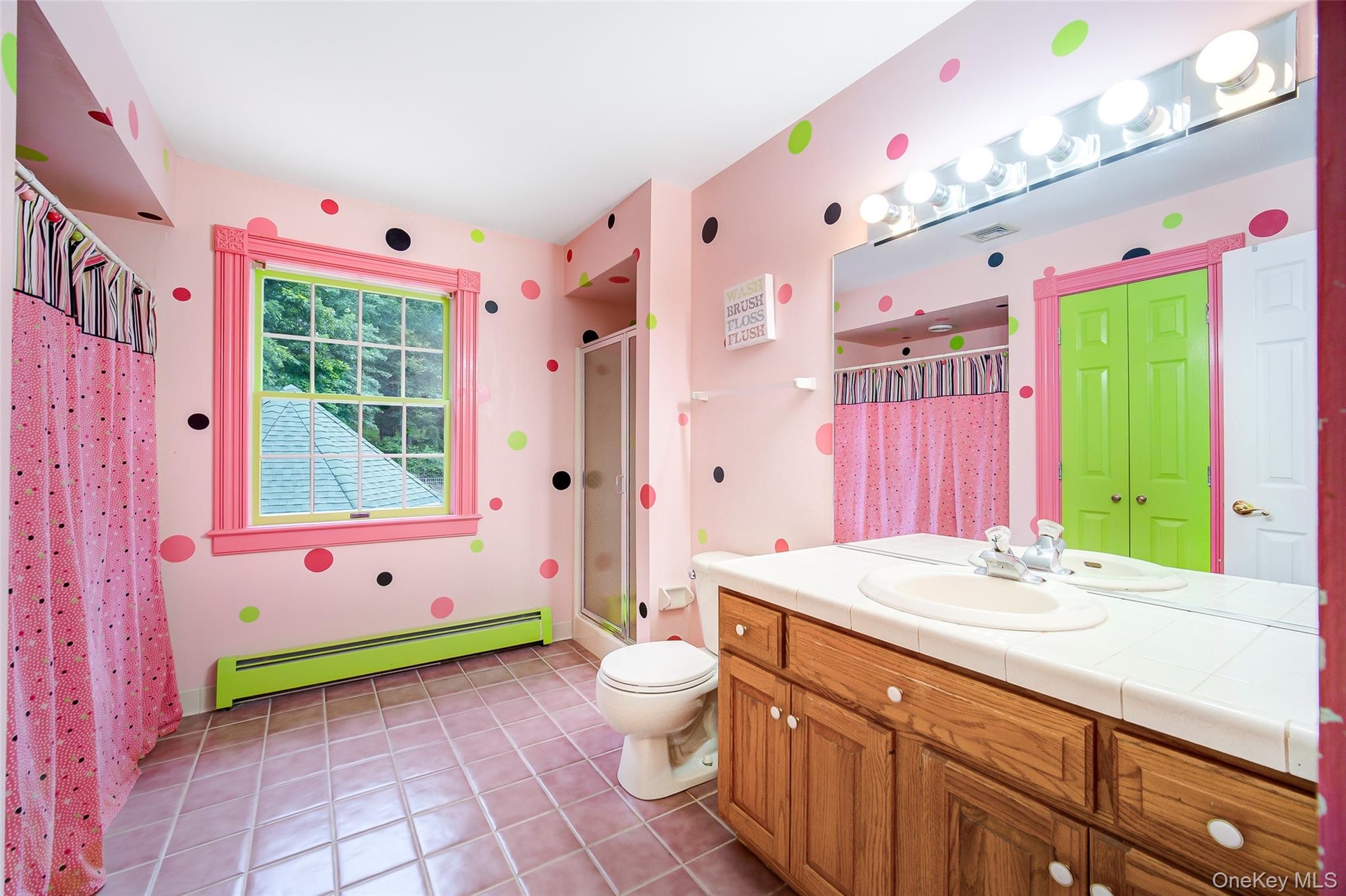 2nd floor playfully designed full bath has separate tub/shower combo and stand up shower unit.