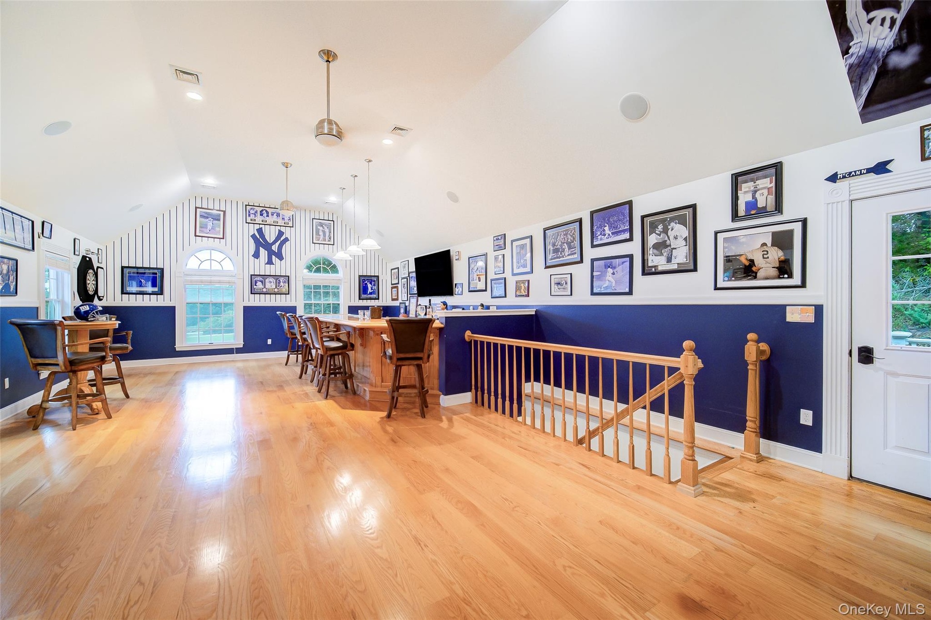 This spectacular Bonus Room is currently an enviable sports room. Radiant heated floors, high ceilings and a custom wood carved bar make this the perf