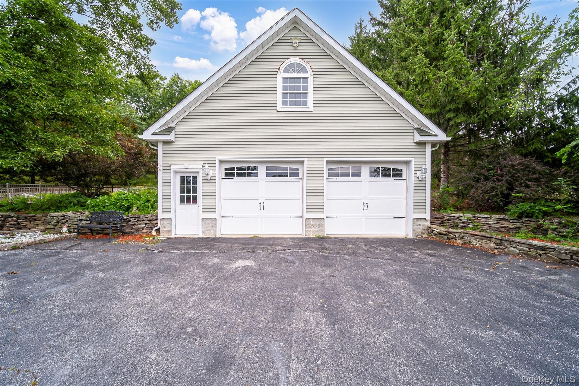 Two-car heated garage with finished upper level.  Perfect for Home based business, storage, extra guest space (with some work) or a workshop.