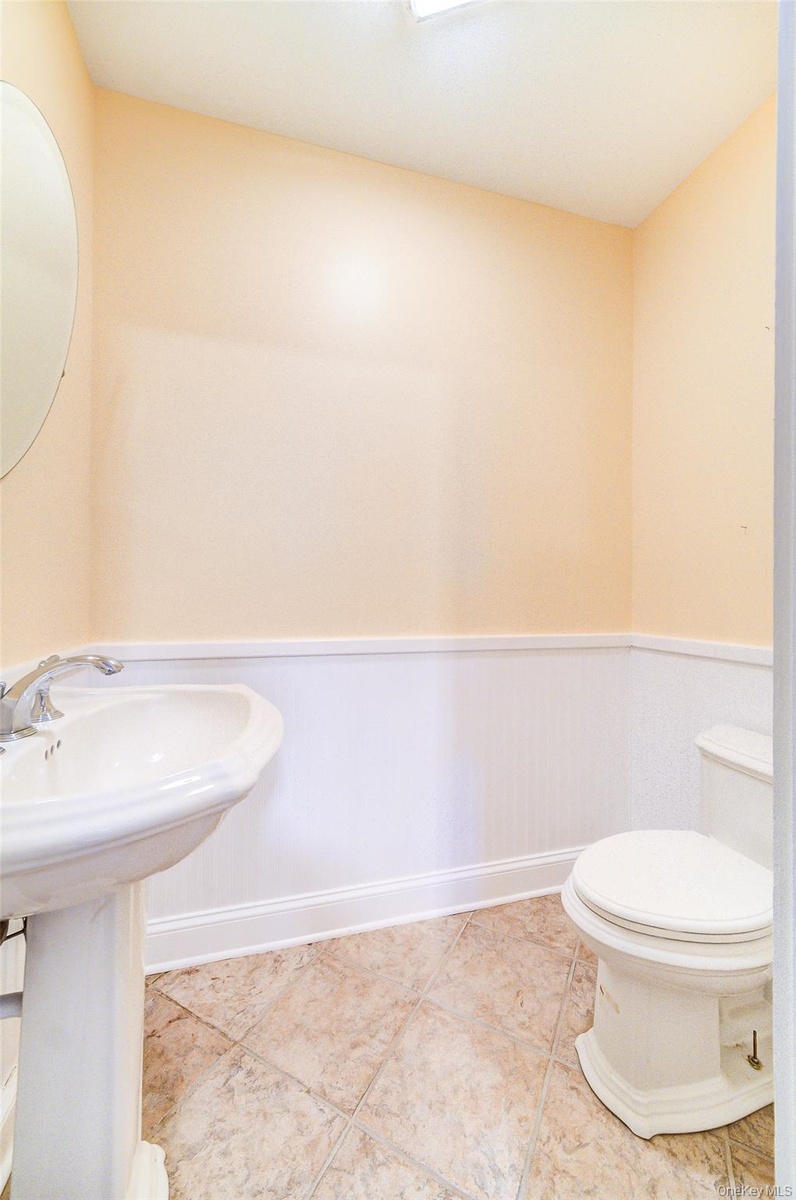 Bathroom #5 is a 1/2 bath and is on the basement level.