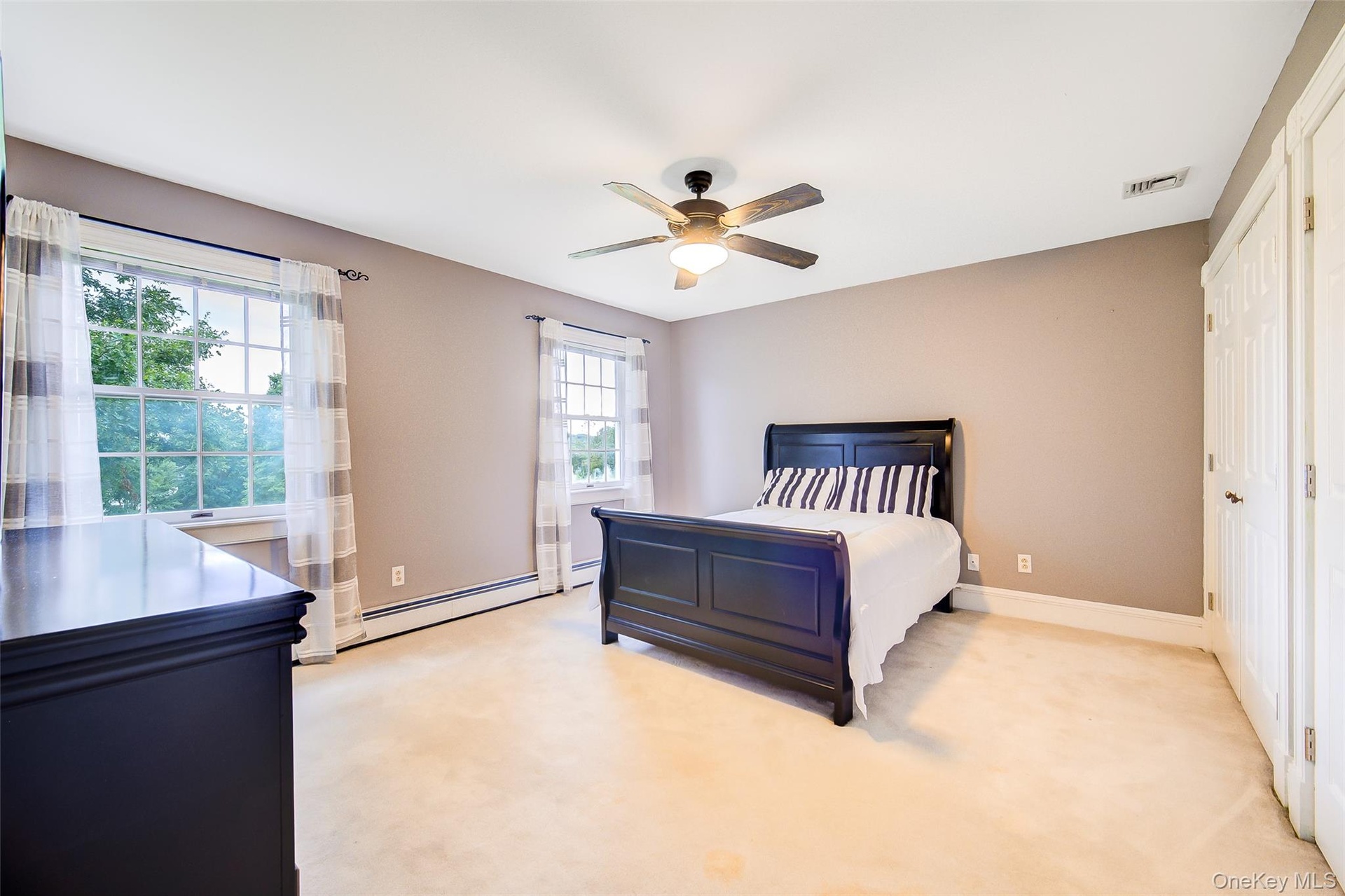 Bedroom #3 is large and has ceiling fan with integrated lighting. Carpeted with room for multiple sleeping arrangements