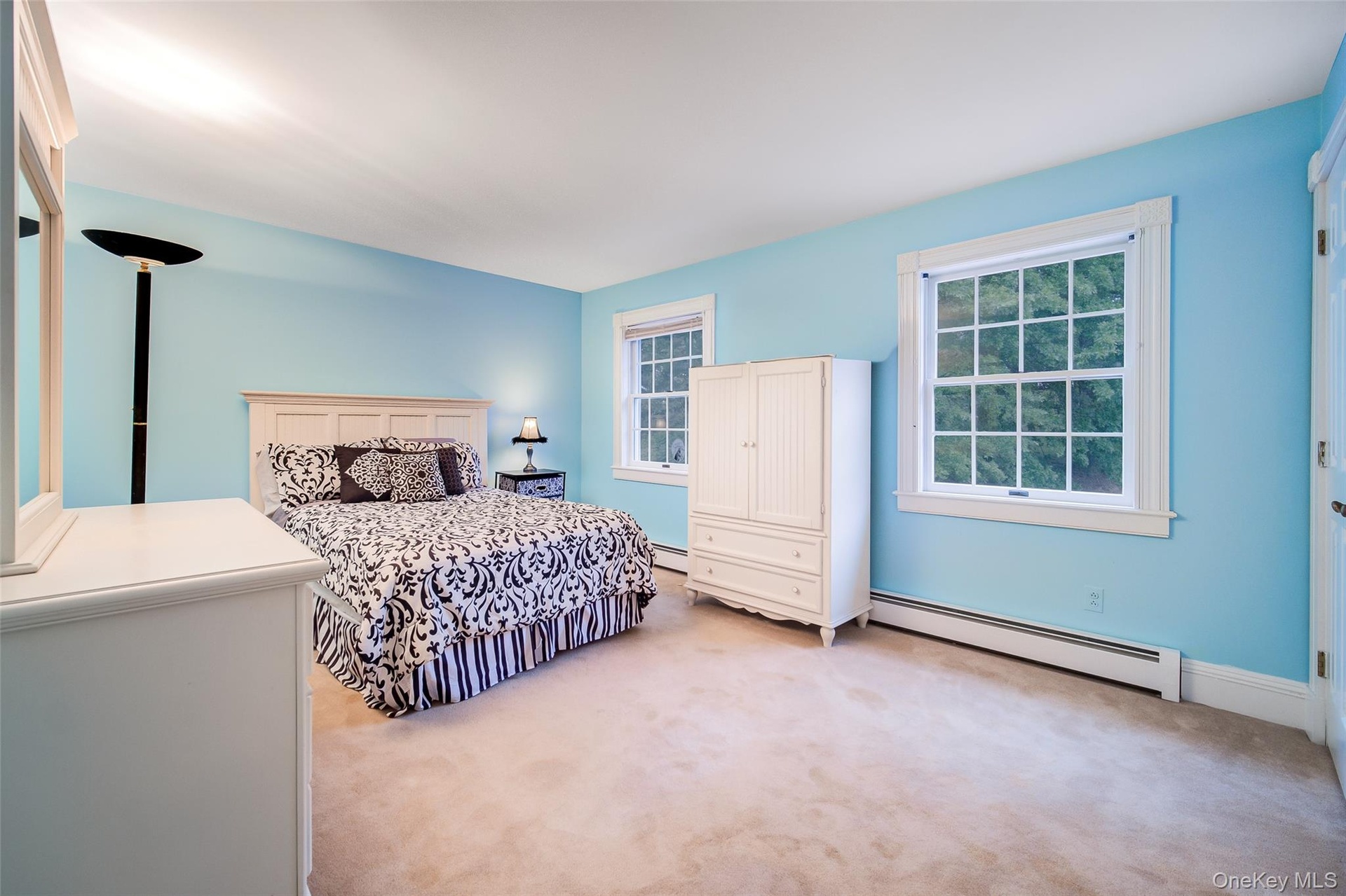 Bedroom #5 Is carpeted and features multiple windows and a large closet.