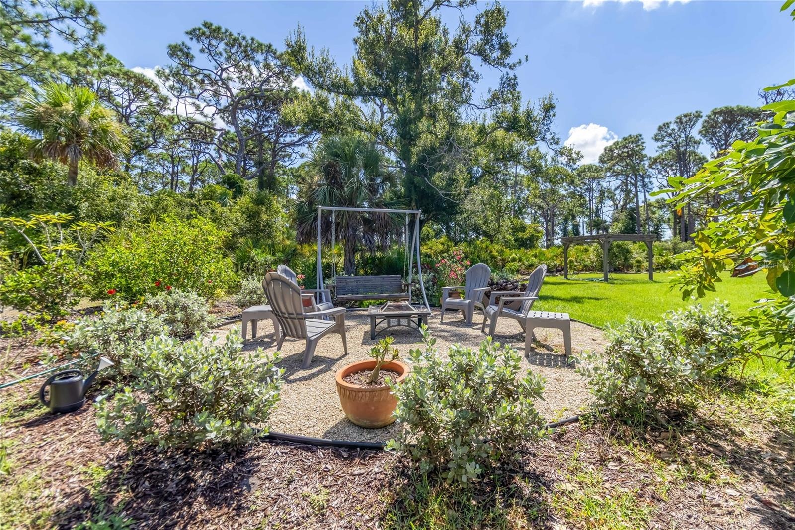 Another view of the fire pit.  Notice the wide open yard and pergola in the background. That is the perfect spot for a wedding (and yes, they had one 