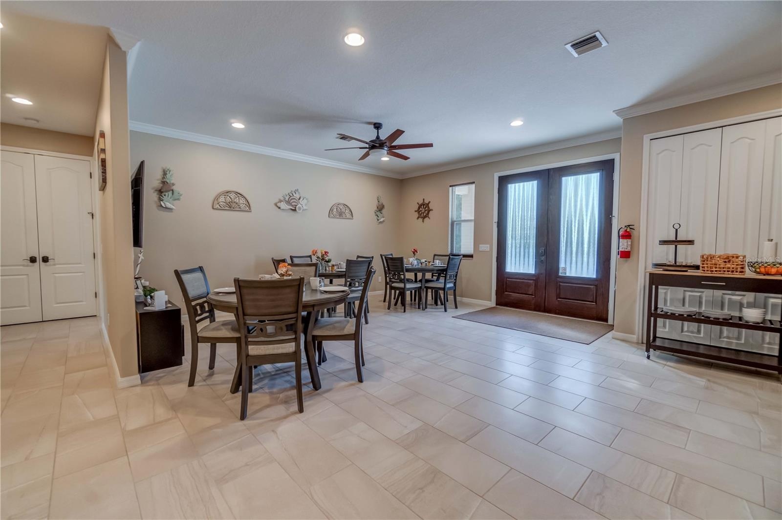 The double doors to the right is a pantry. The double doors to the left houses the water heater and storage. There are two water heater closets. One o