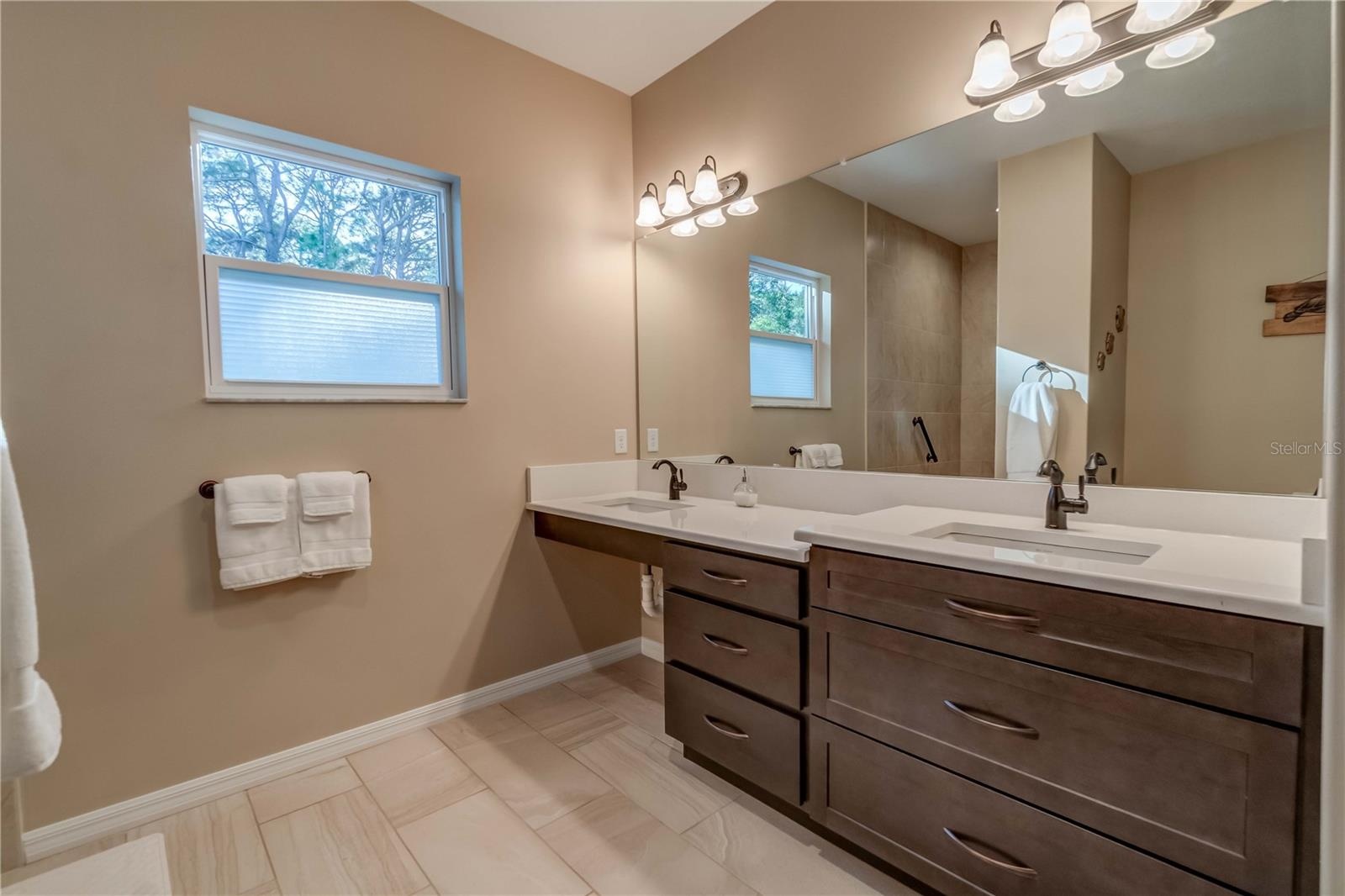 Two sinks for ADA compability. These are custom maple cabinets.