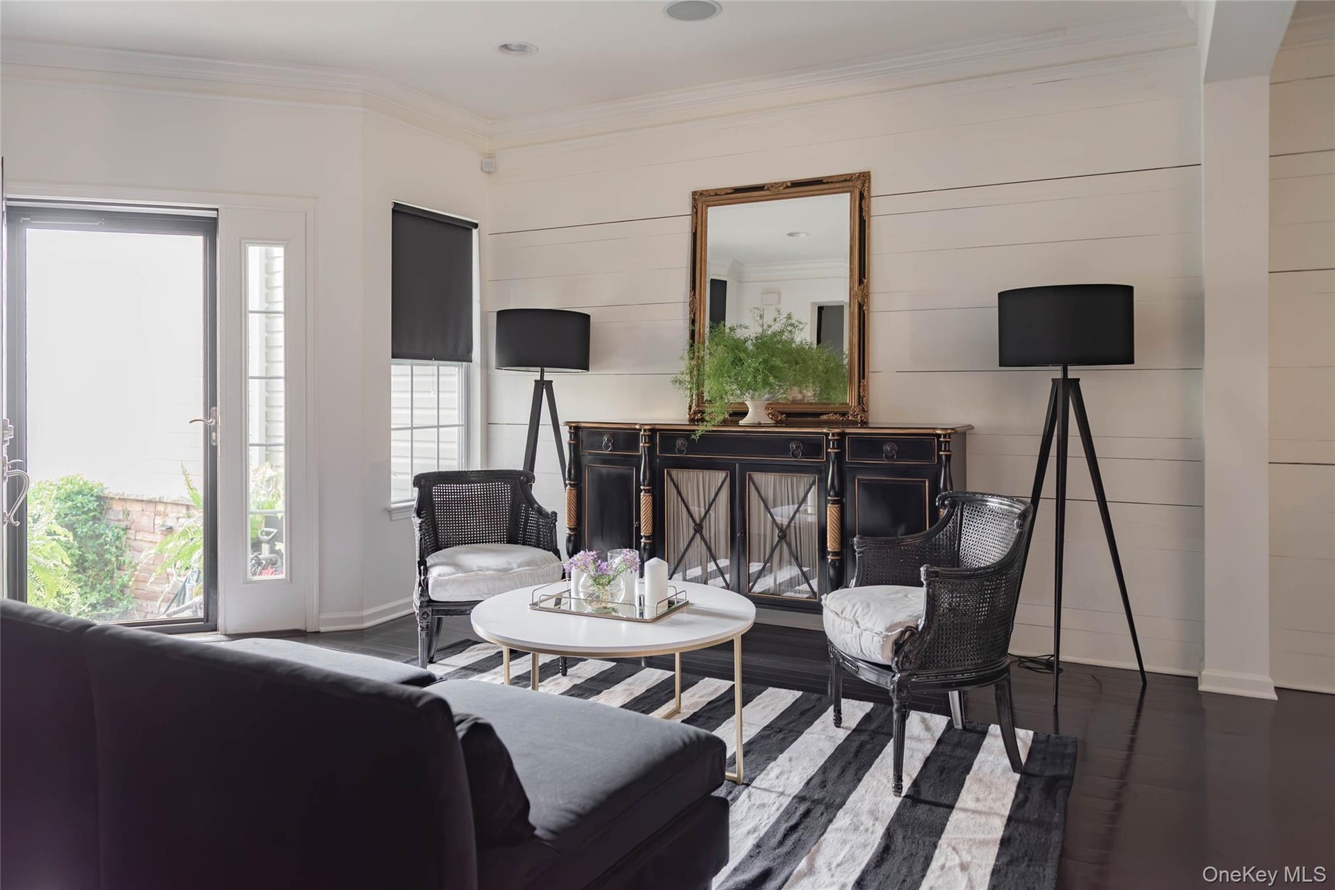 Livingroom/open floorplan with hardwood floors and beamed ceilings