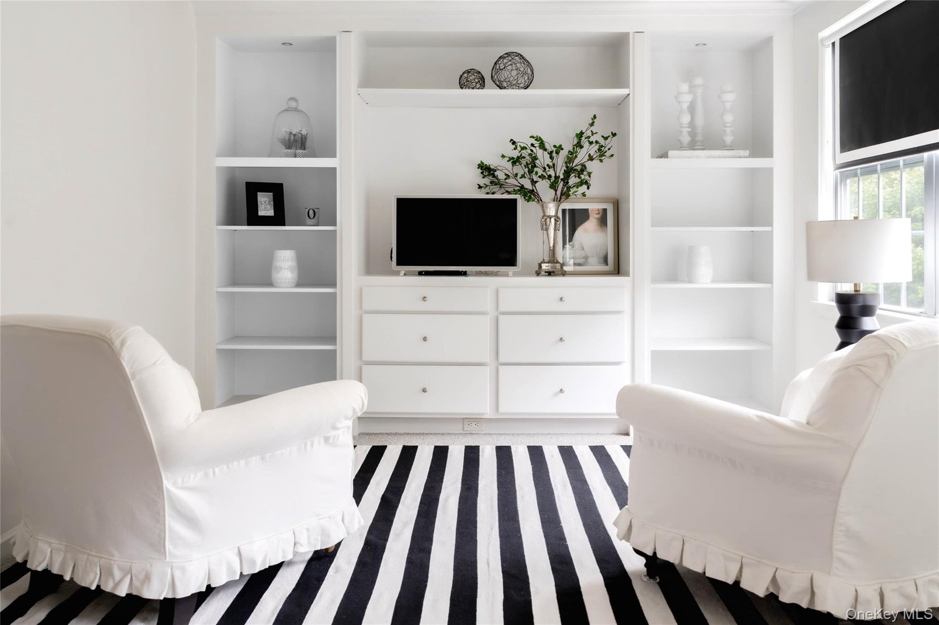 Seating area with built-ins in primary bedroom