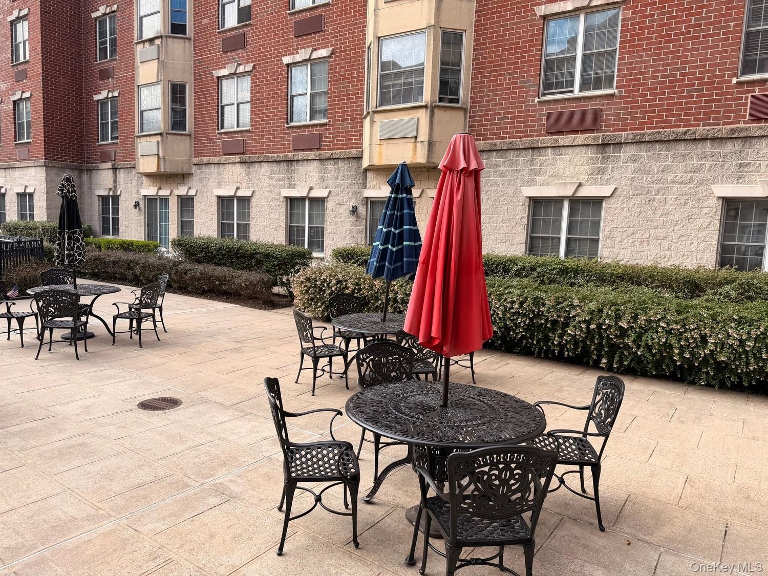 Courtyard patio with tables and shade umbrellas