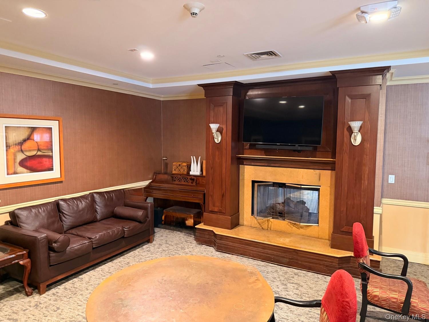 Over sized party room with fireplace, piano and lounge chairs available can be rented/reserved