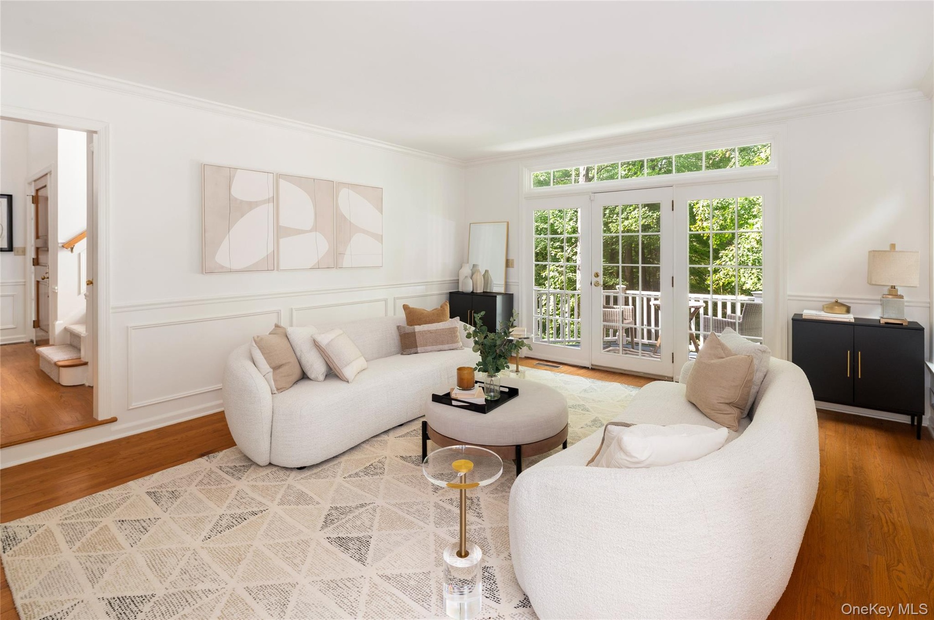 To the left of foyer is the formal living room with balcony