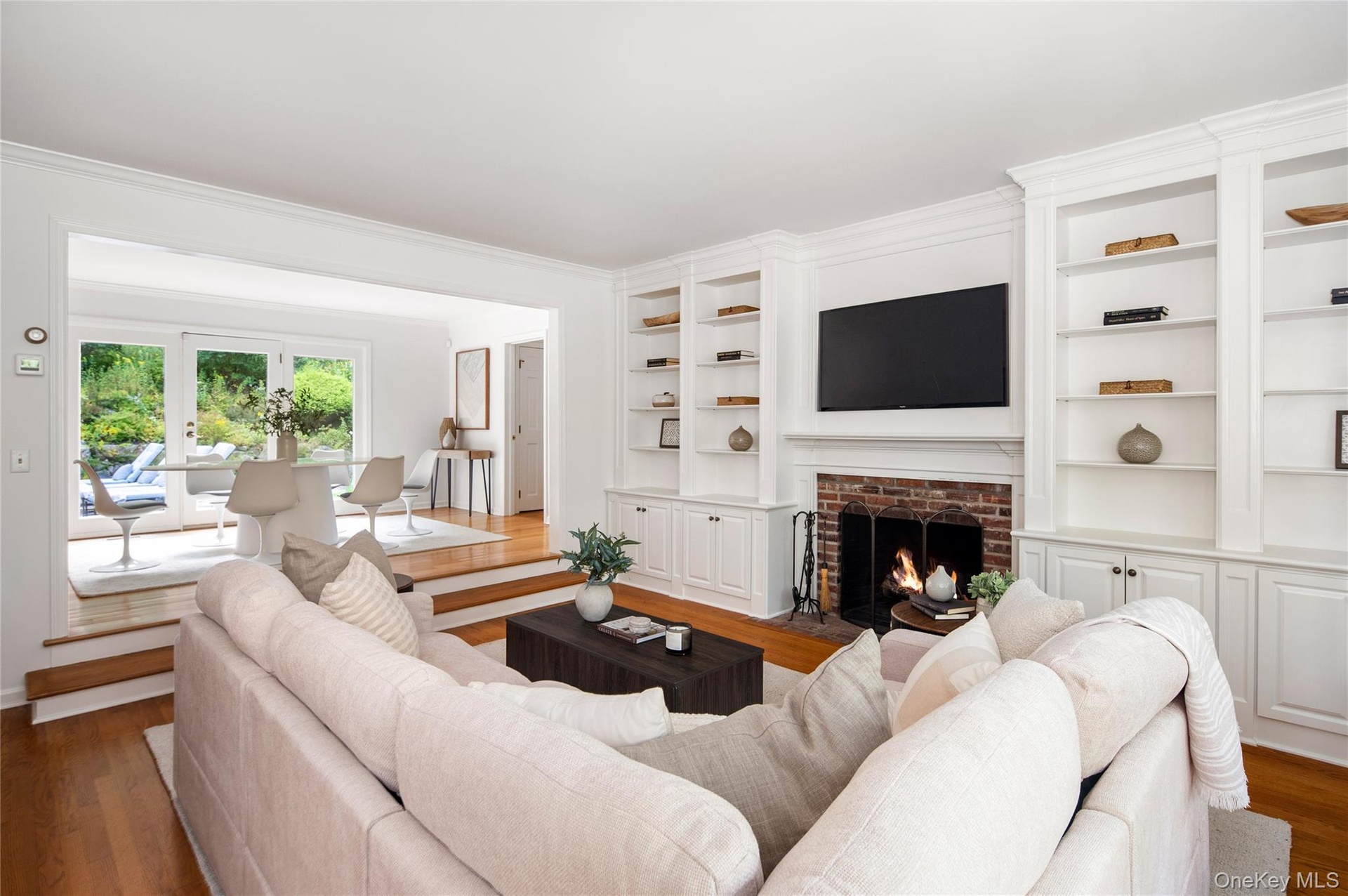 With the third fireplace showing easy access to kitchen & eating area