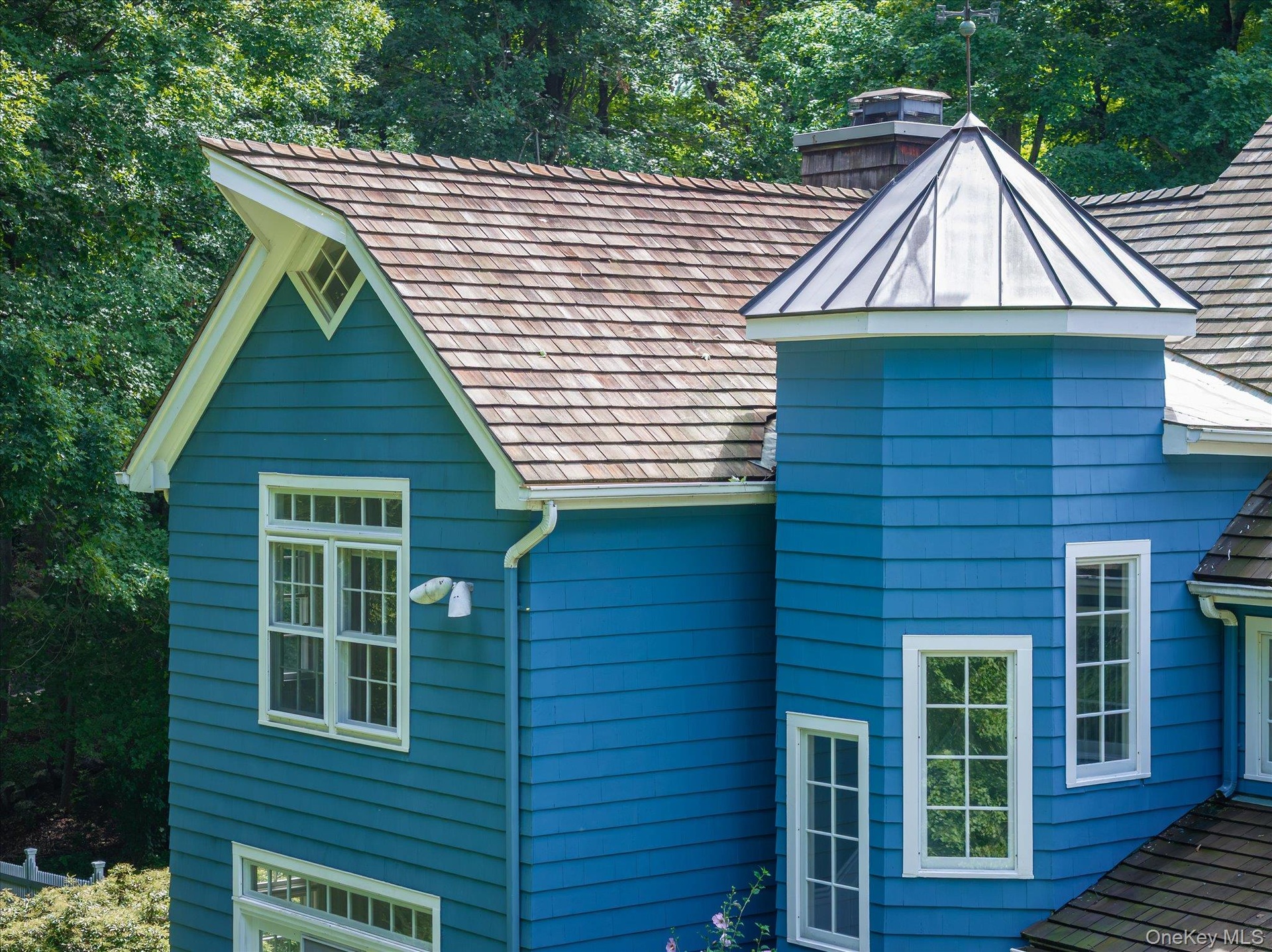 Cedar shingle multidimensional roof line & copper roof turret