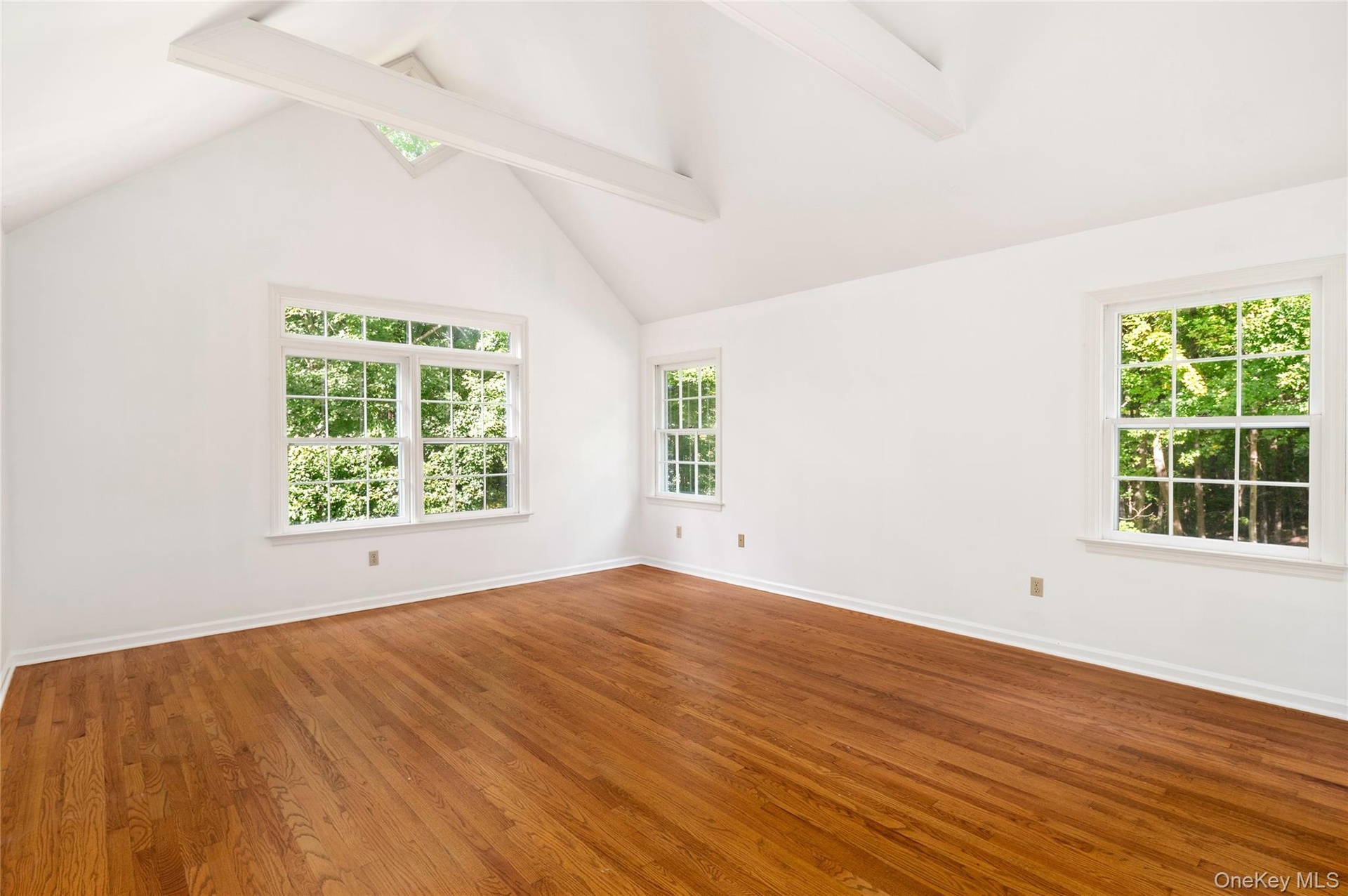 Showing vaulted ceiling and beams