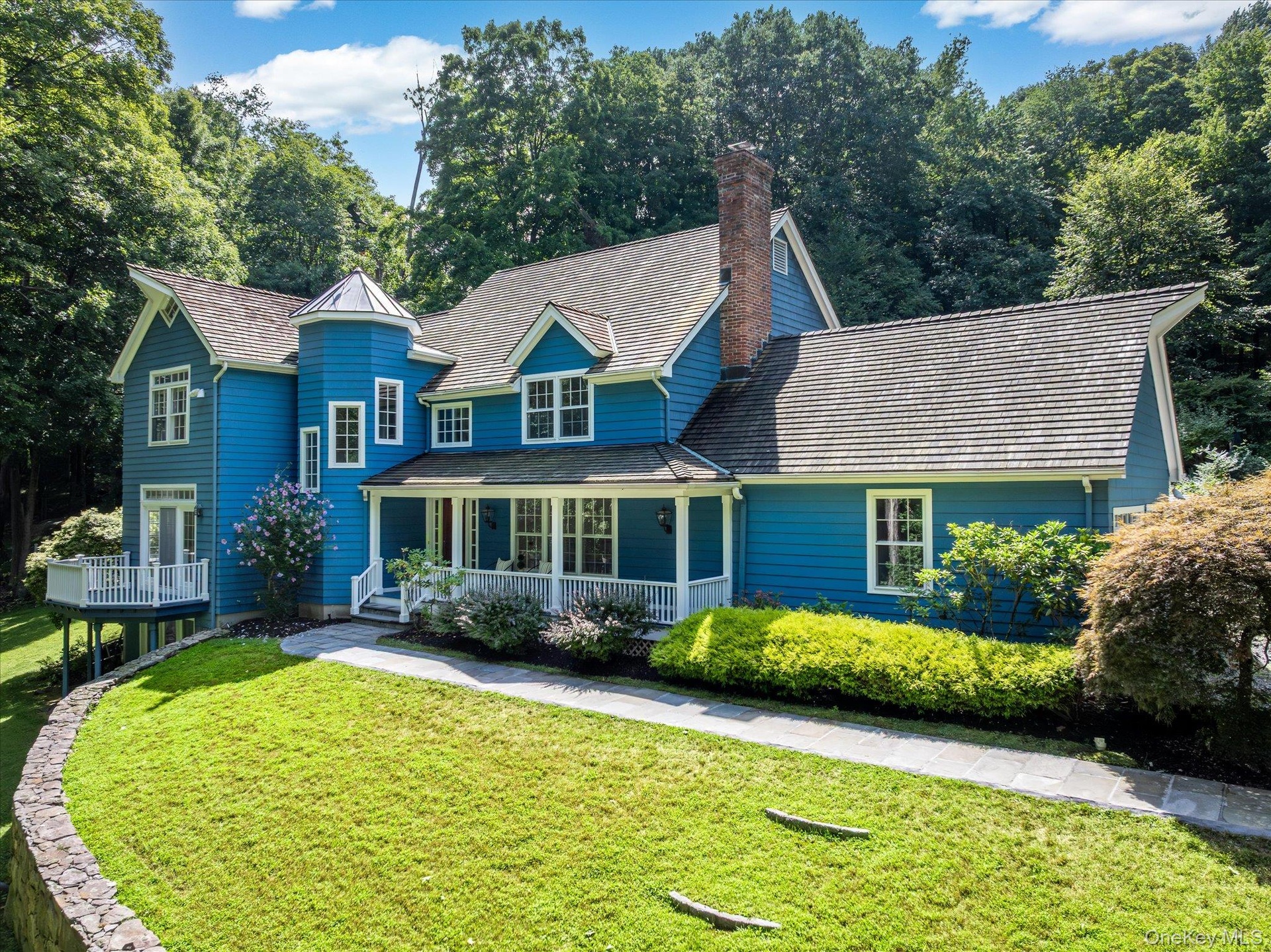 Showing covered front porch and balcony