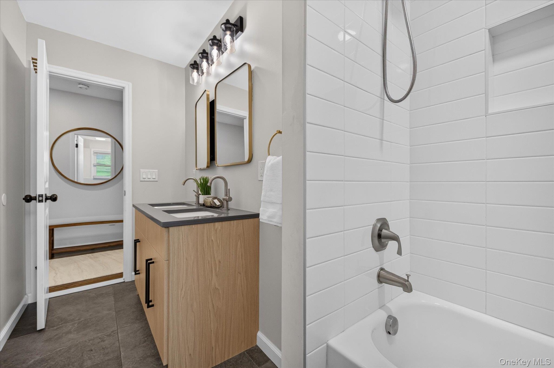 Dual vanity with wood-finish cabinetry and rectangular vessel sinks