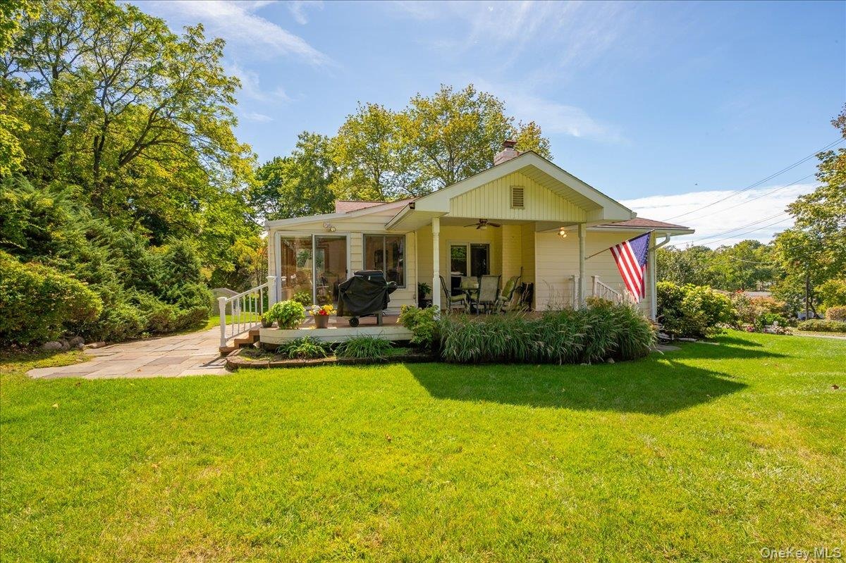 Covered porch with access from both dinning room and four seasons room. the perfect place to start or end the day