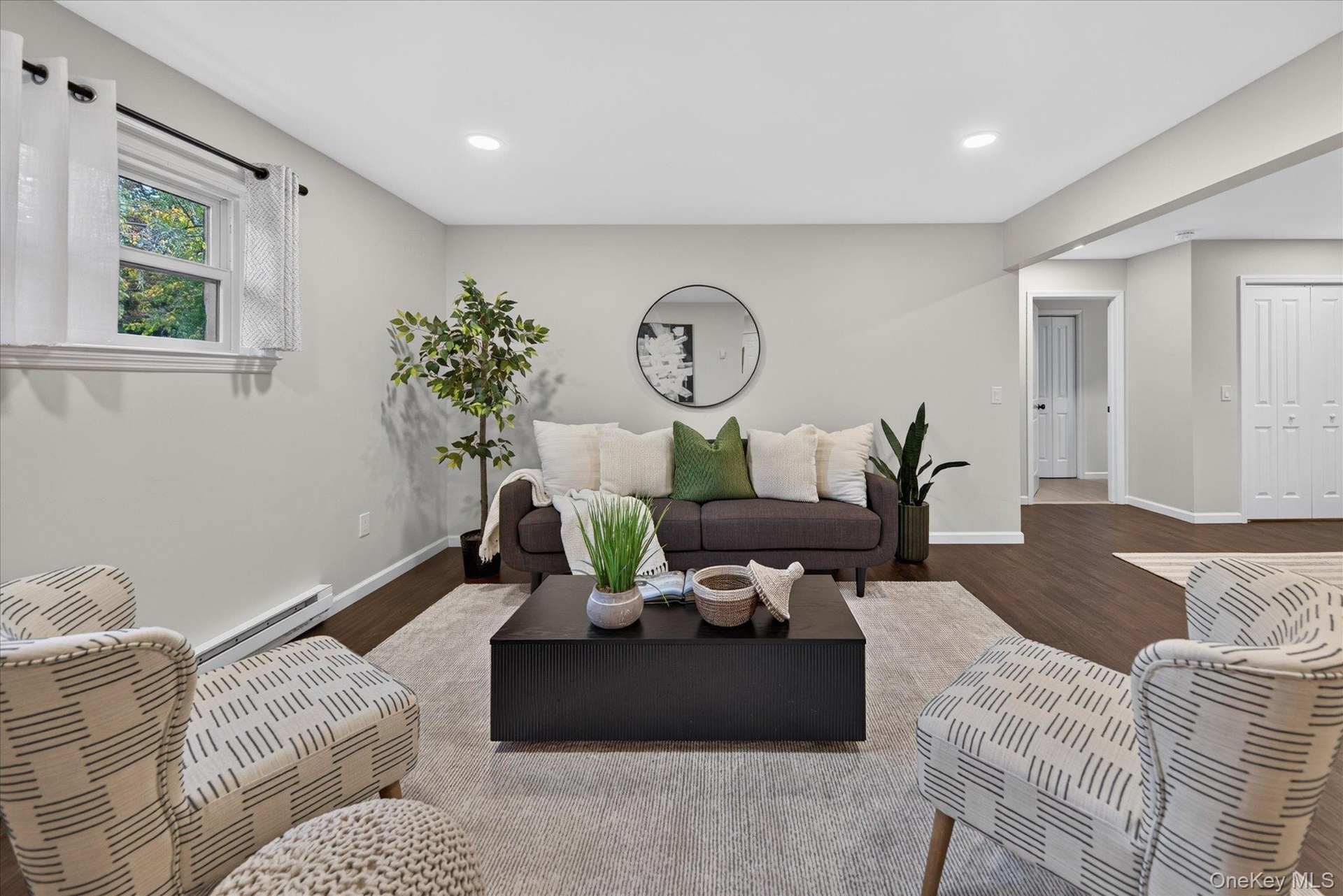 Lower-level. Recessed lighting, wood-finish flooring, white trim, and white paneled doors