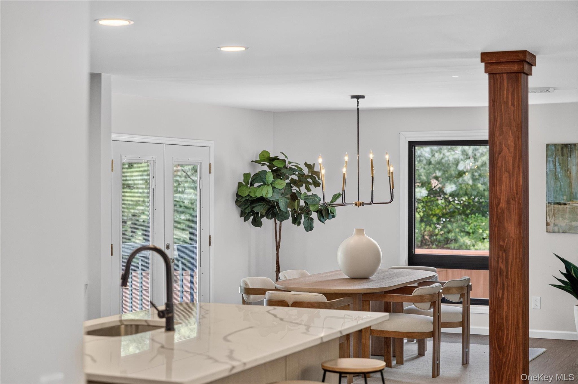 Kitchen island with a built-in sink and a gooseneck faucet