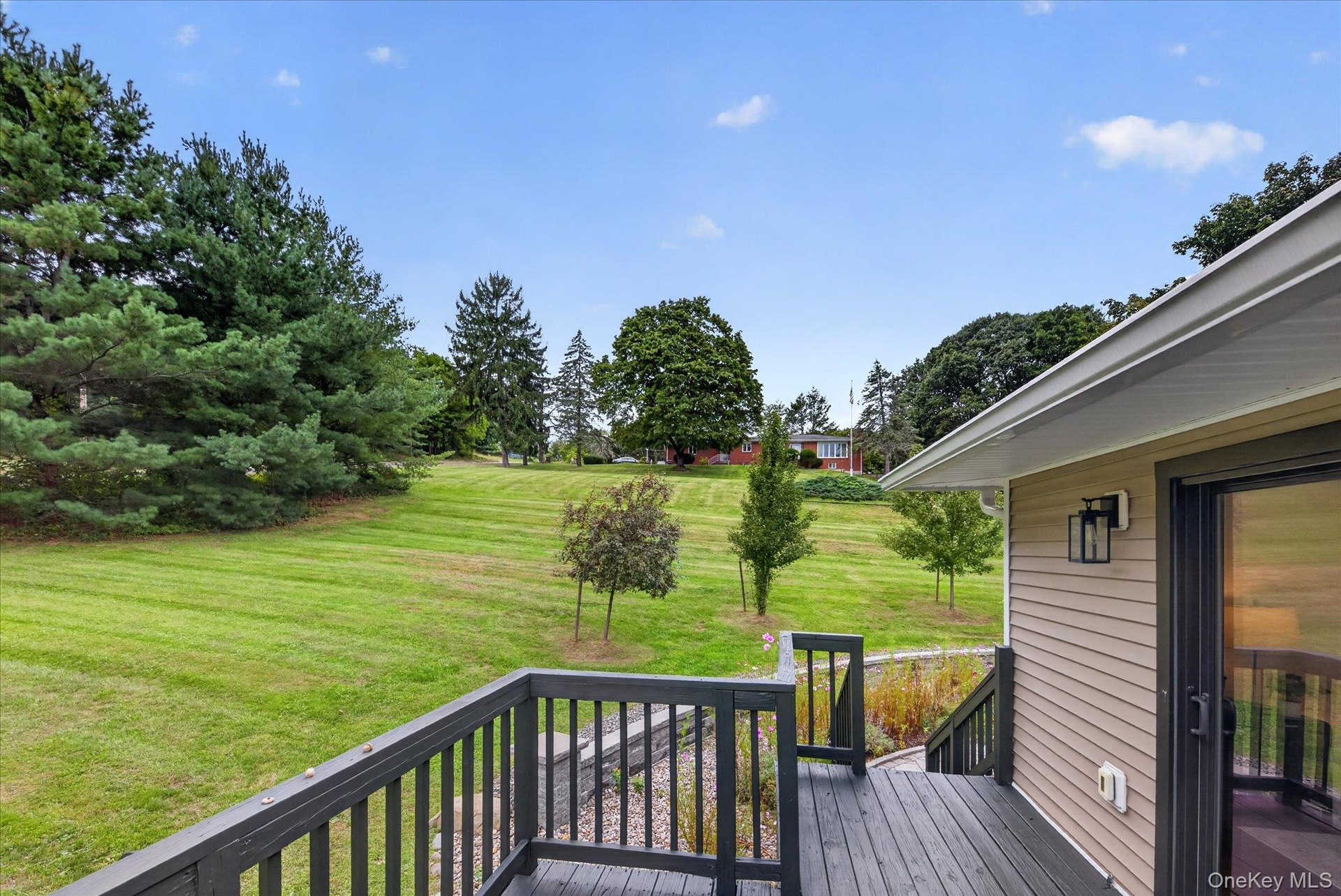 Expansive green space with mature trees