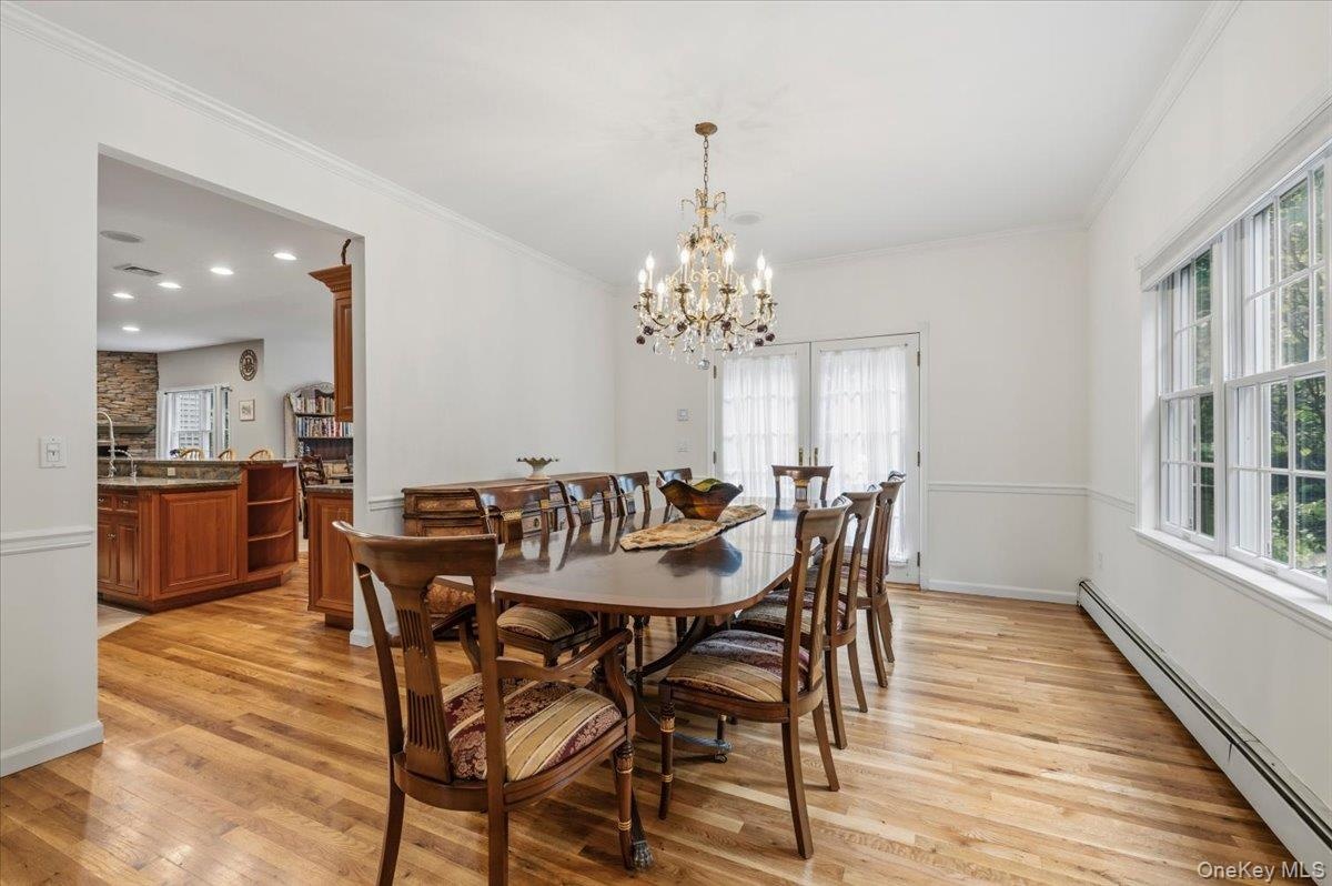 Formal Dinning Room w/ French Doors Out To Backyard
