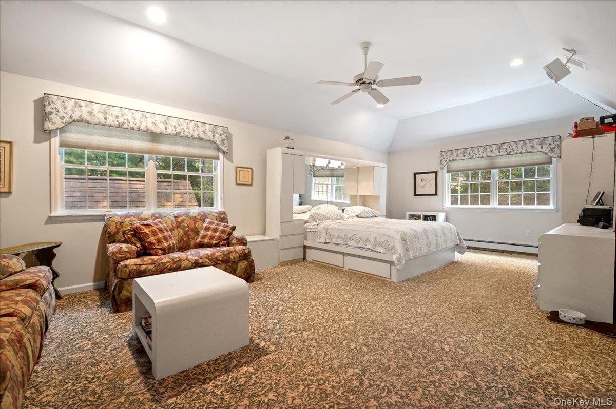 Primary Bedroom With Vaulted Ceiling, Natural Light and Oversized Walk-in Closet