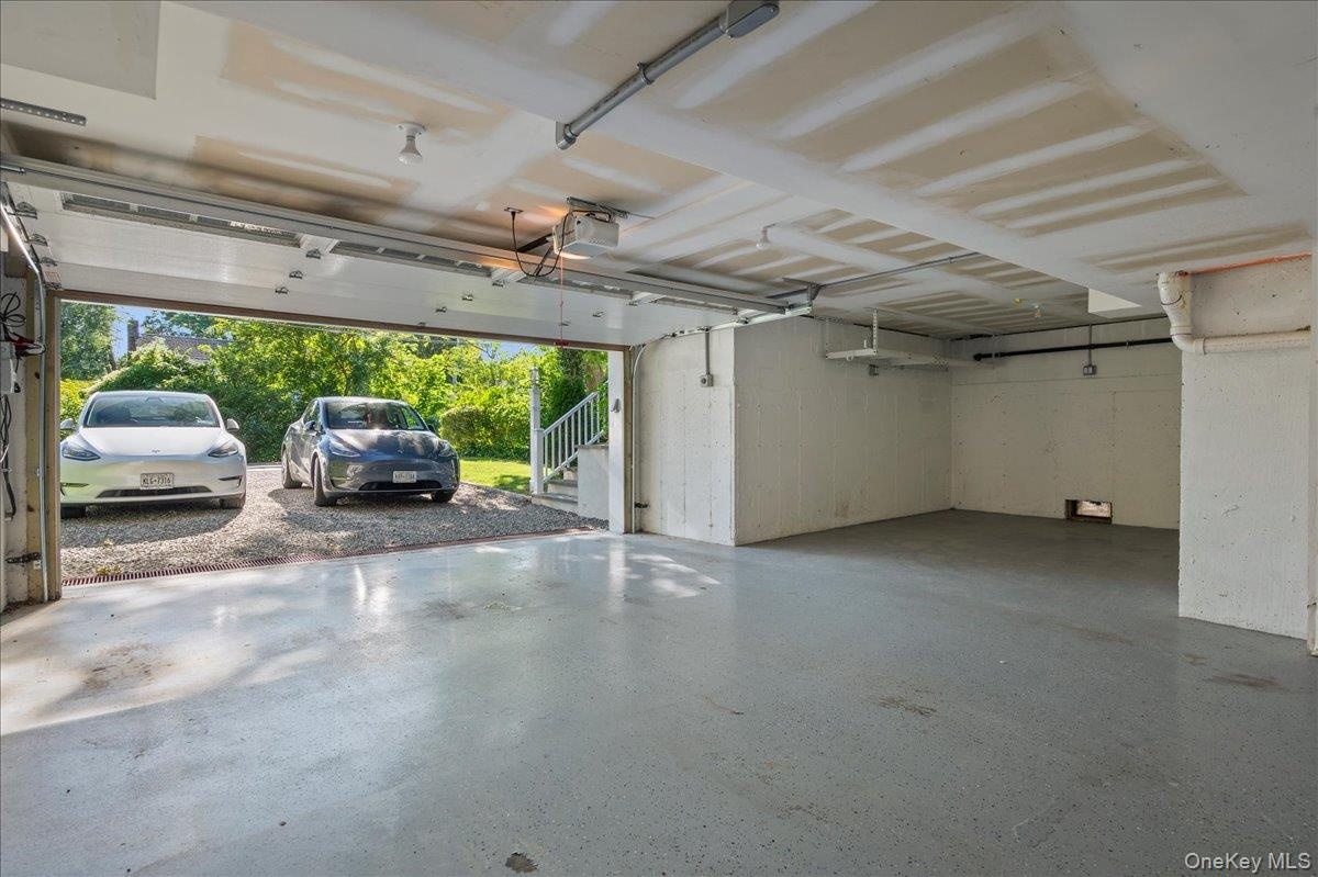 Large two car garage with overflow storage and EV port