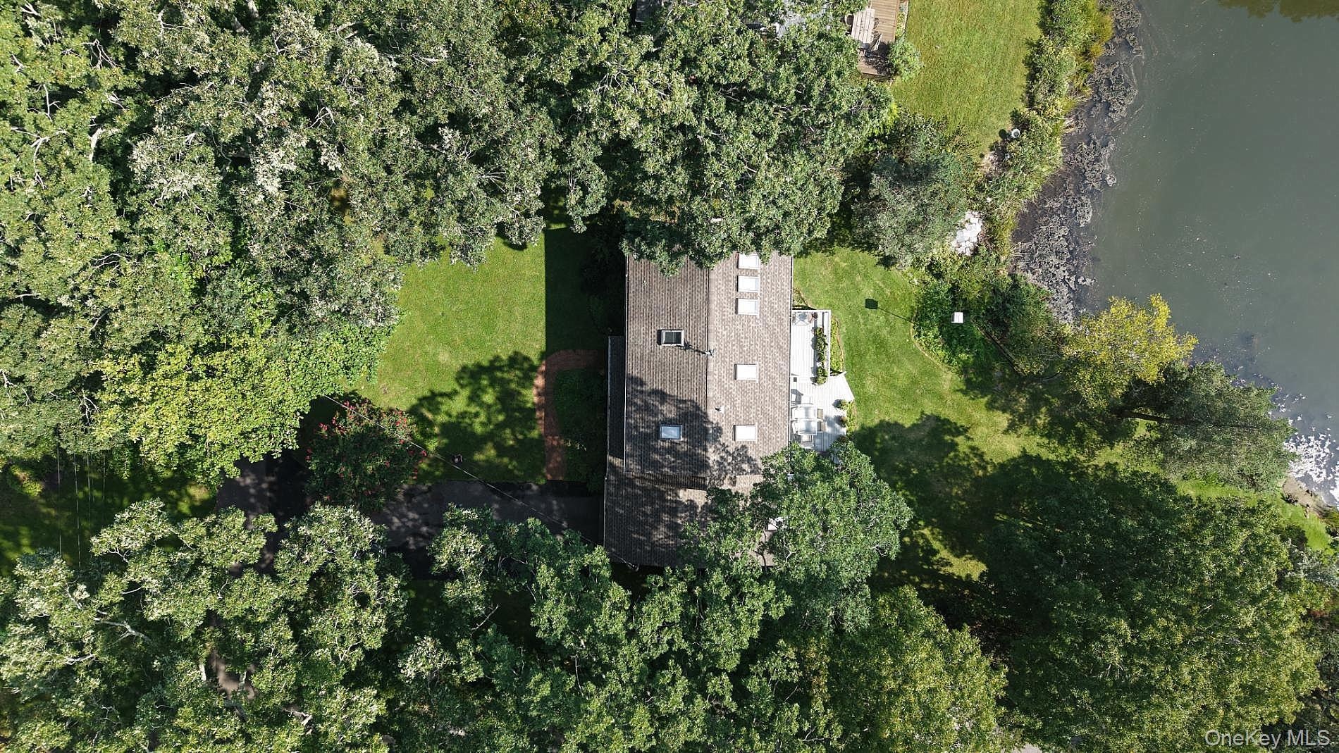 Aerial view of the home and waterfront property