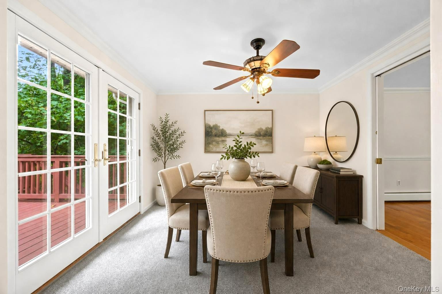 Virtually staged  dining room with french doors out to deck