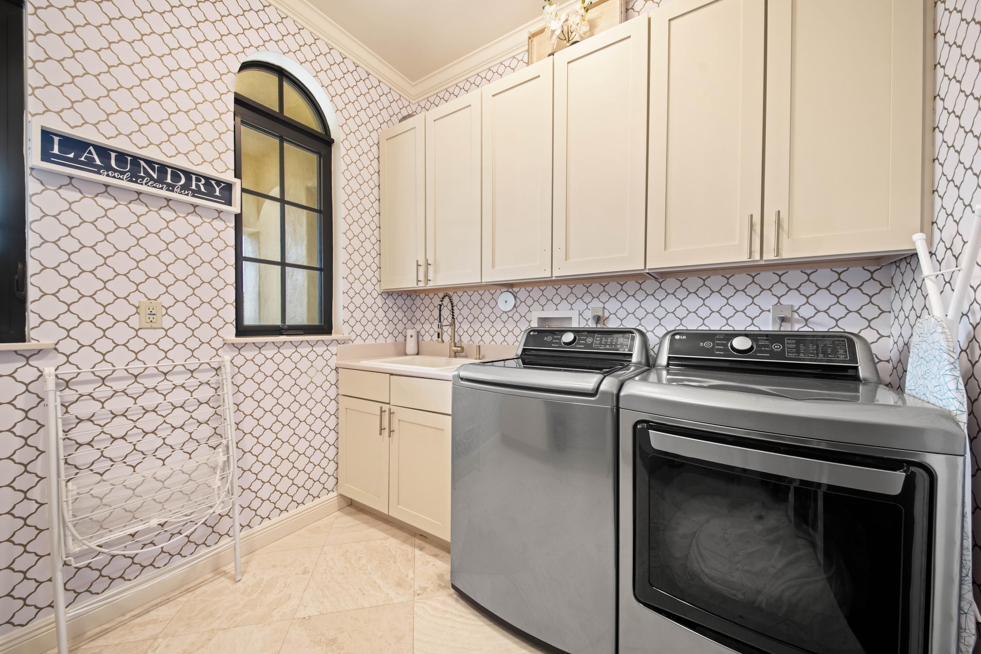 Expansive Laundry Suite with sink and ample storage